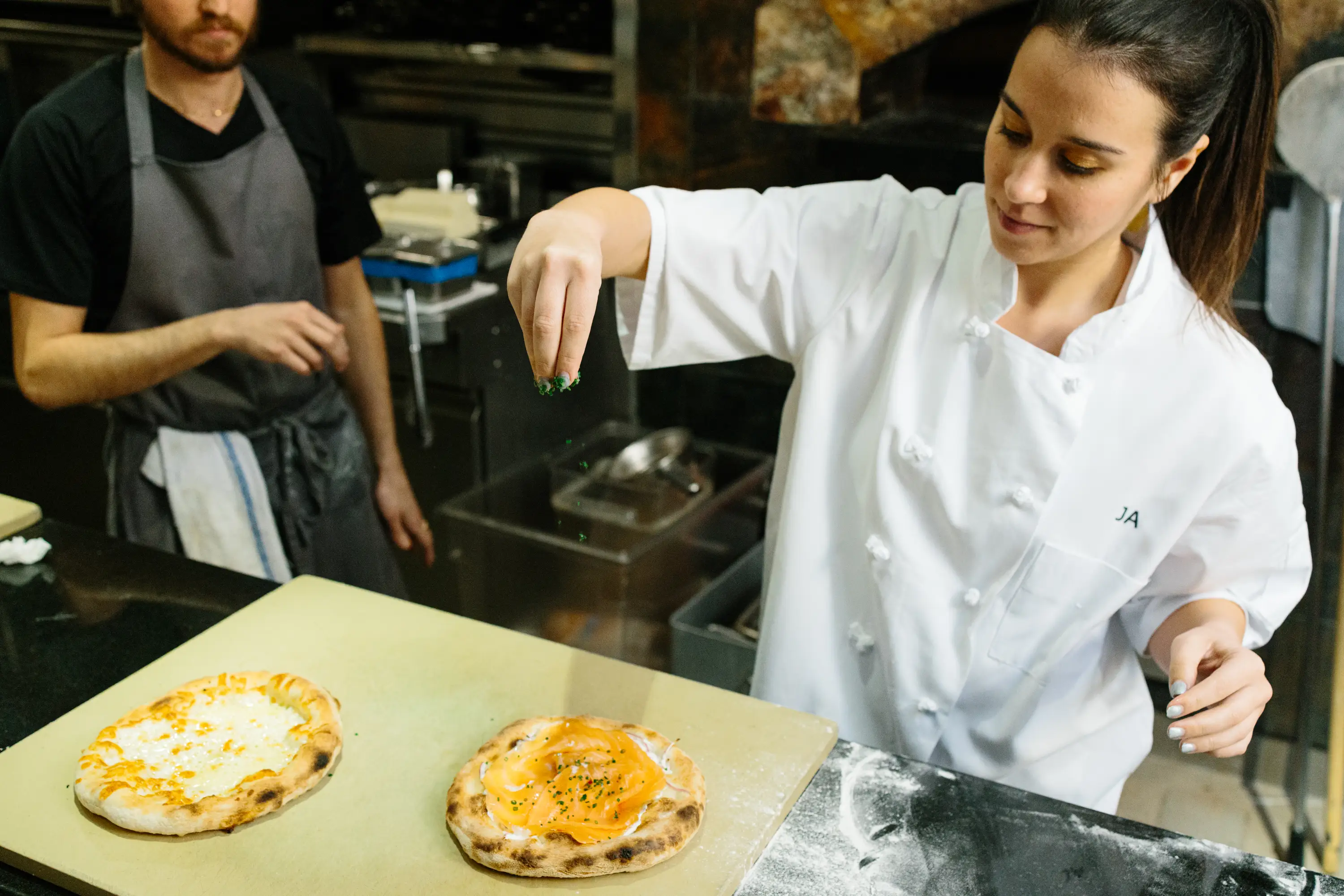 Making smoked salmon pizza