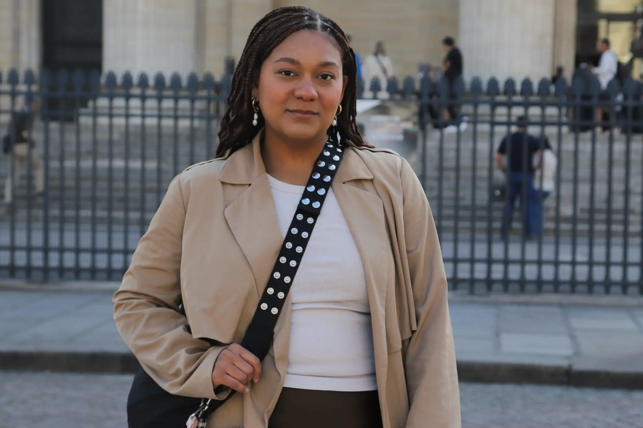 Woman Naydeline Mejia smiling with crossbody bag