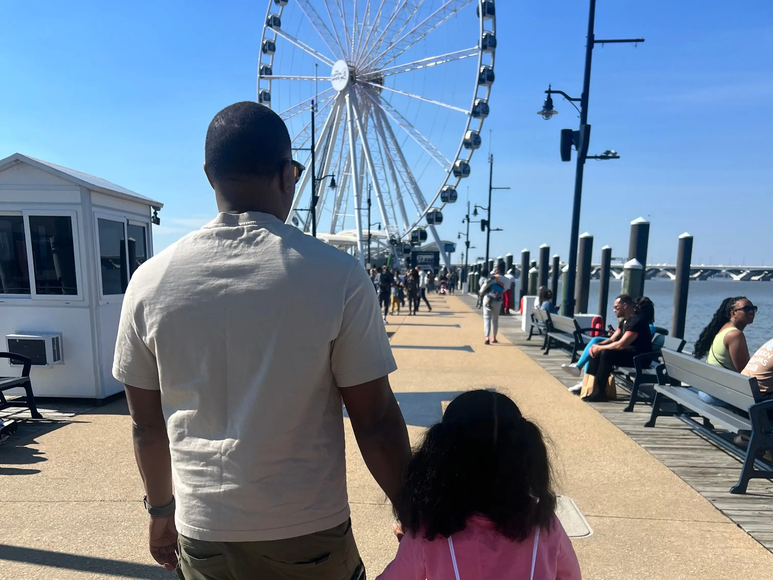 Dad holding daughter's hand