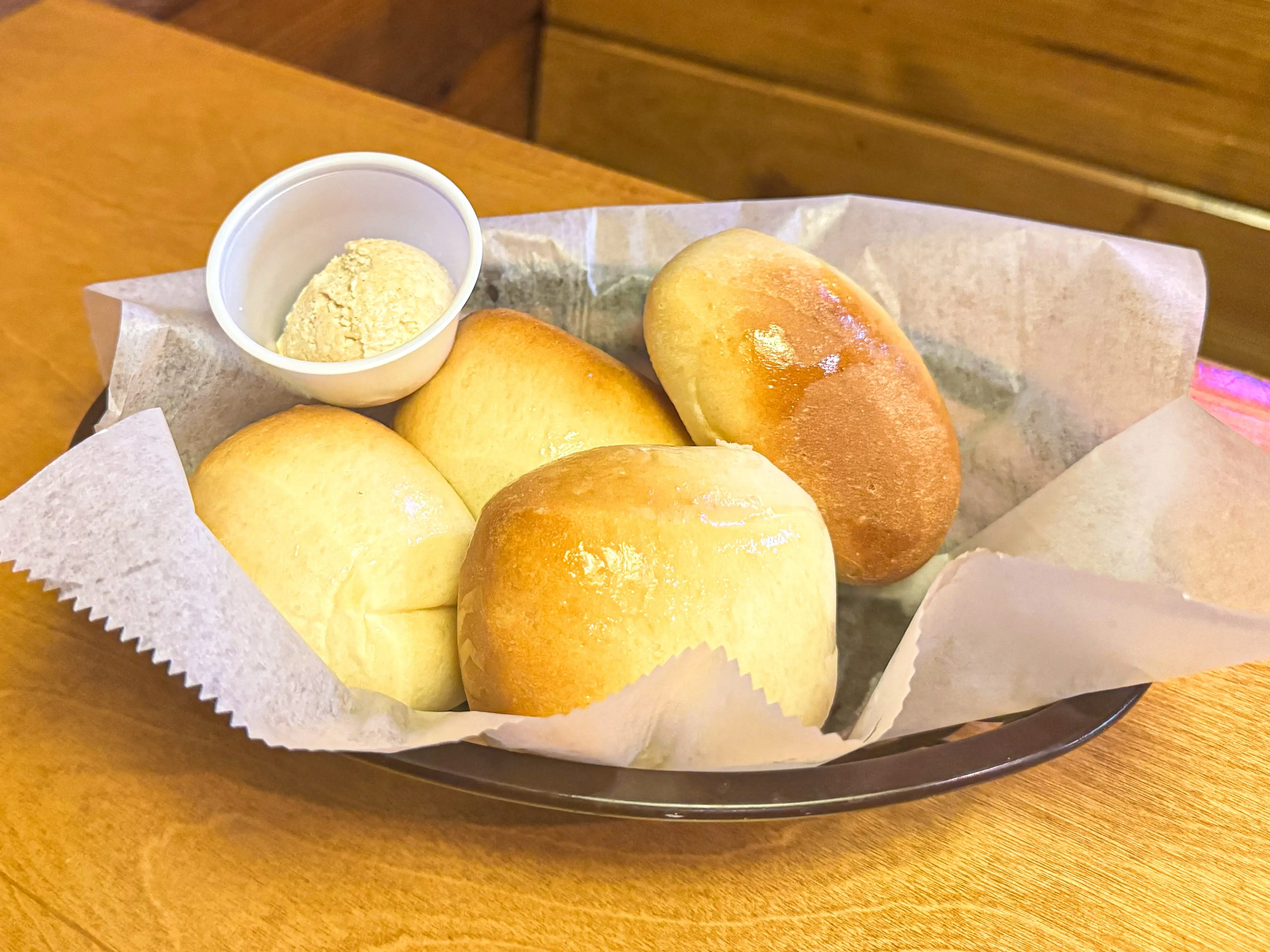A basket of rolls and butter.