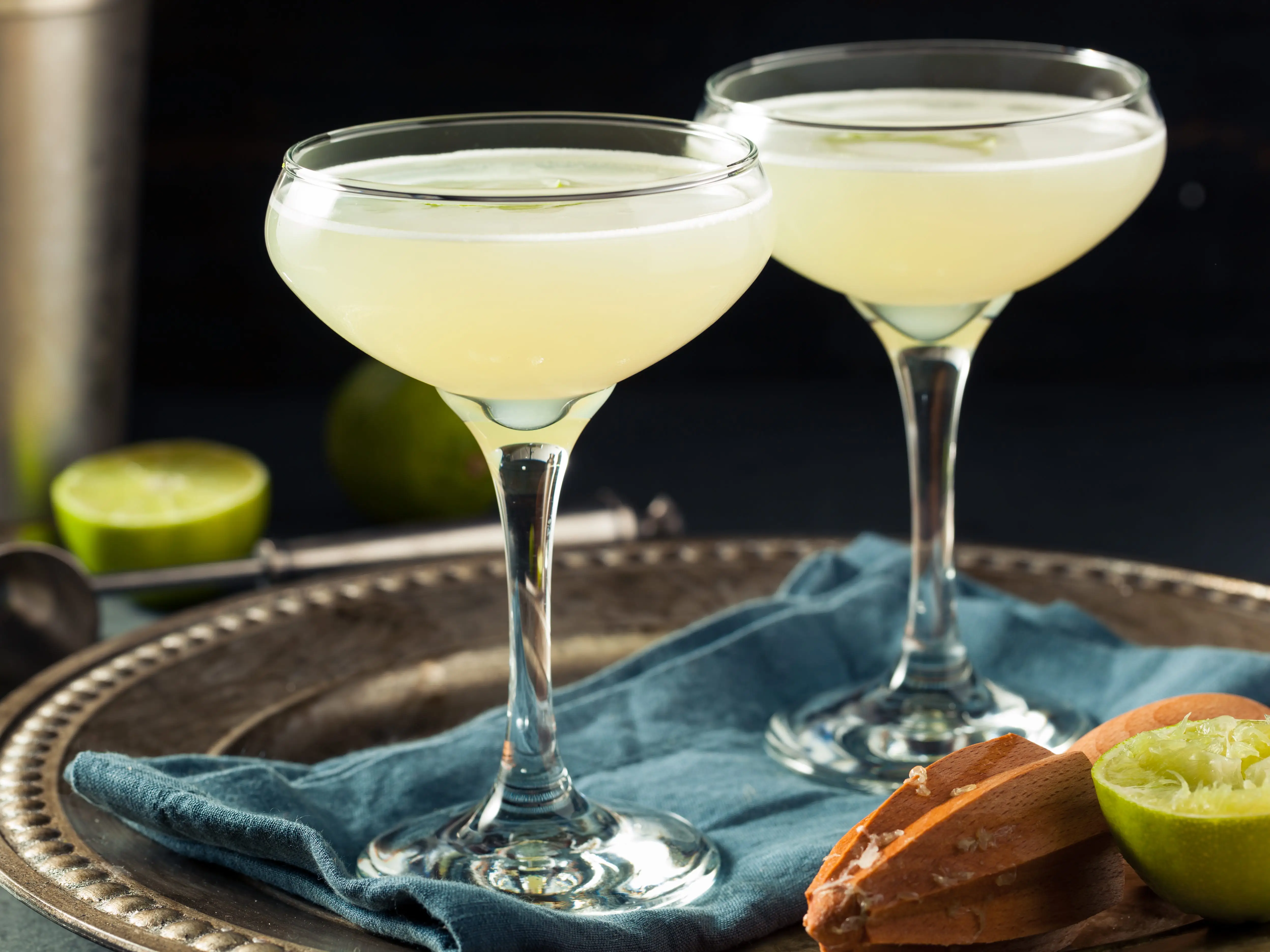 Two gimlet cocktails on a tray.