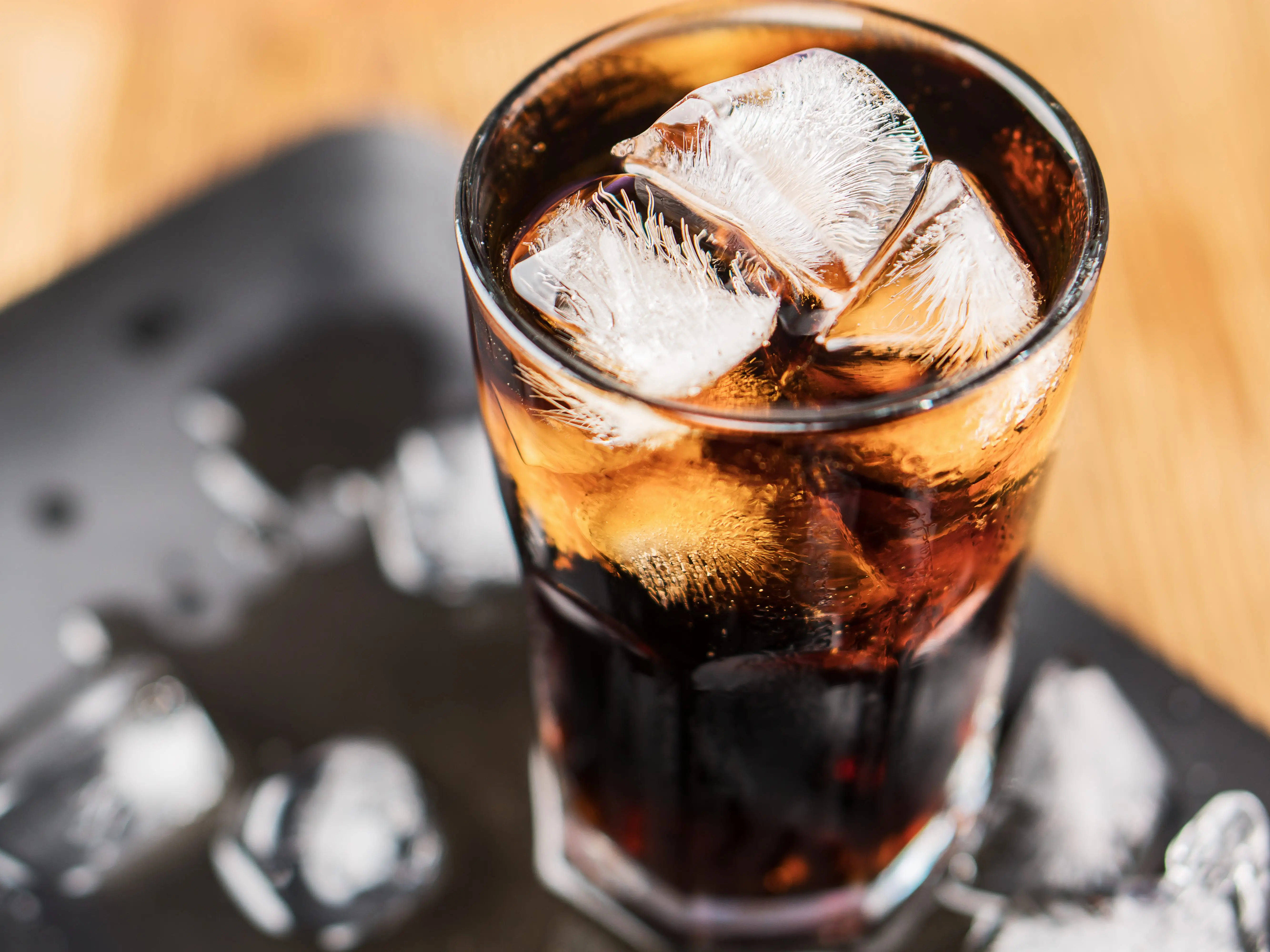 A glass of Coke with ice.