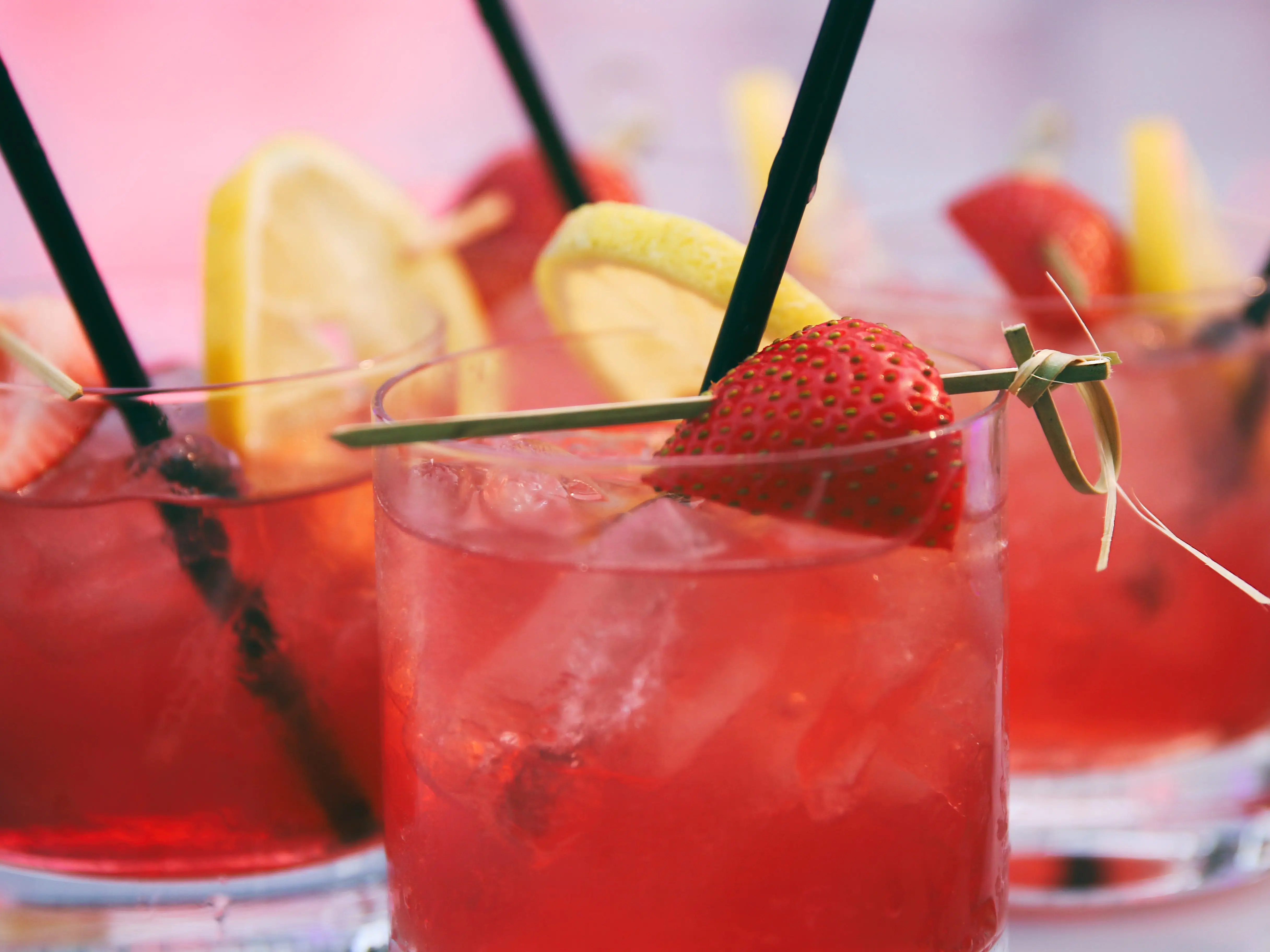 Several strawberry-lemonade cocktails.