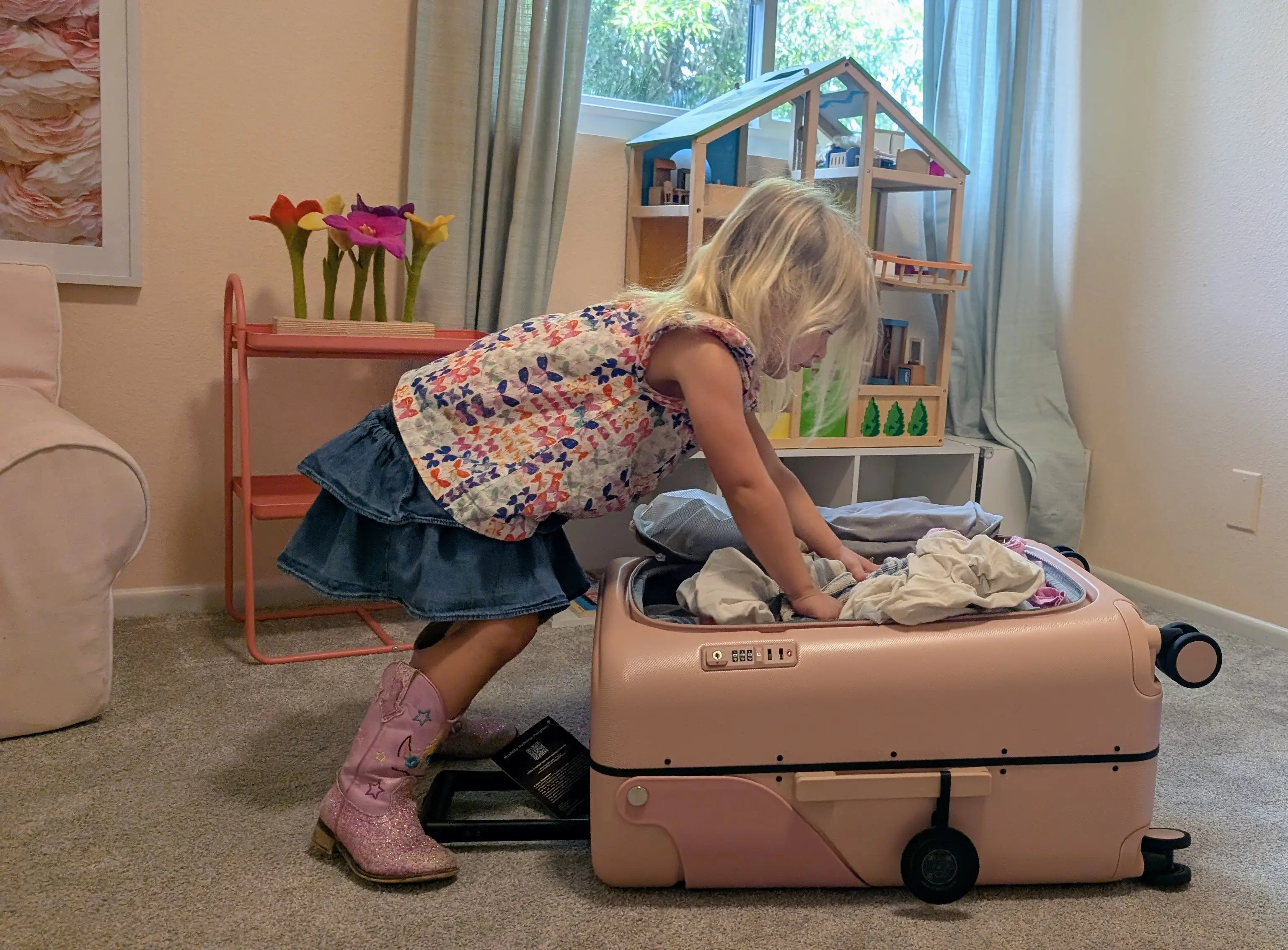 Toddler packing suitcase