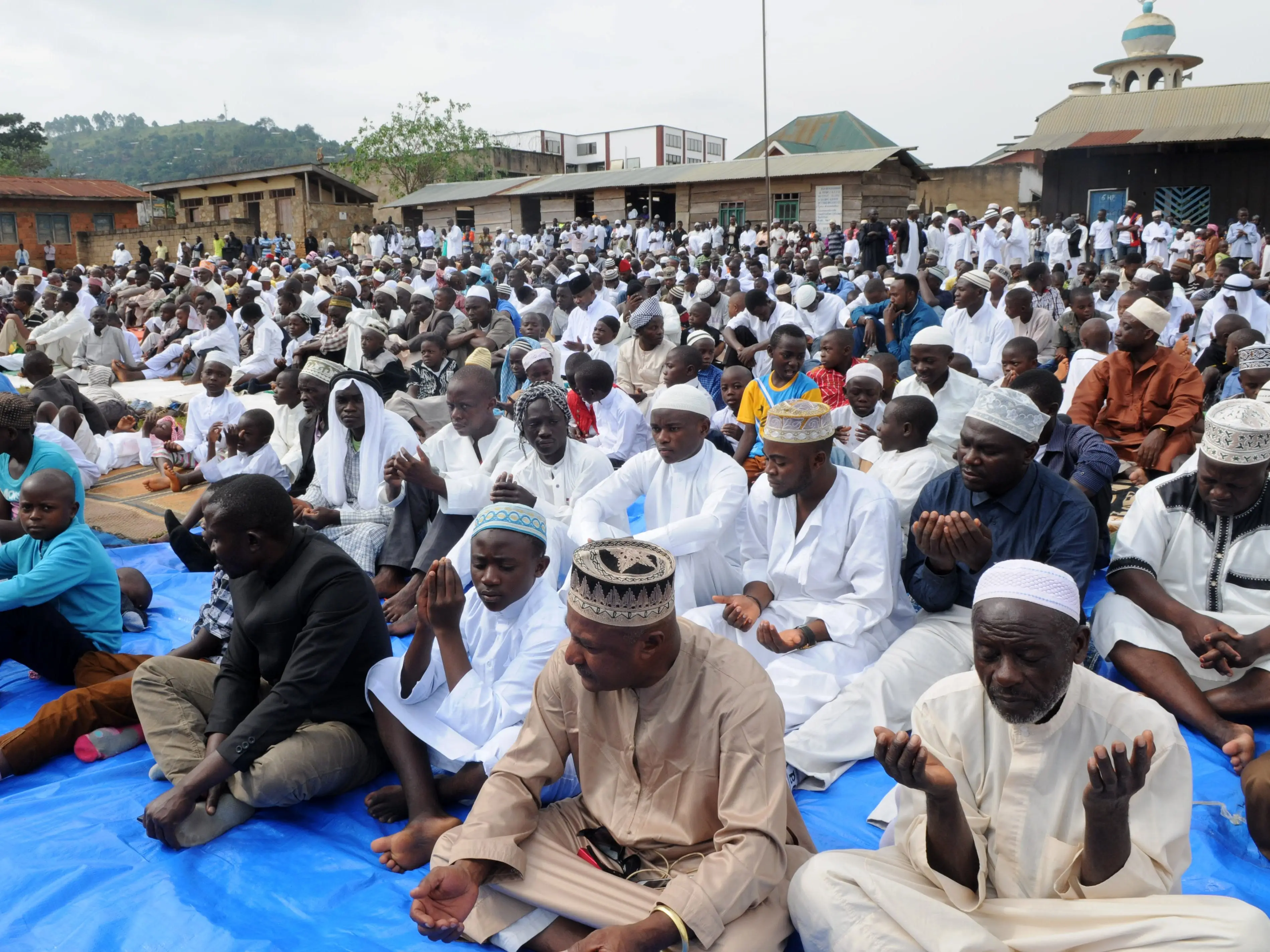 A large group of Muslims in Beni, Democratic Republic of the Congo, praying.