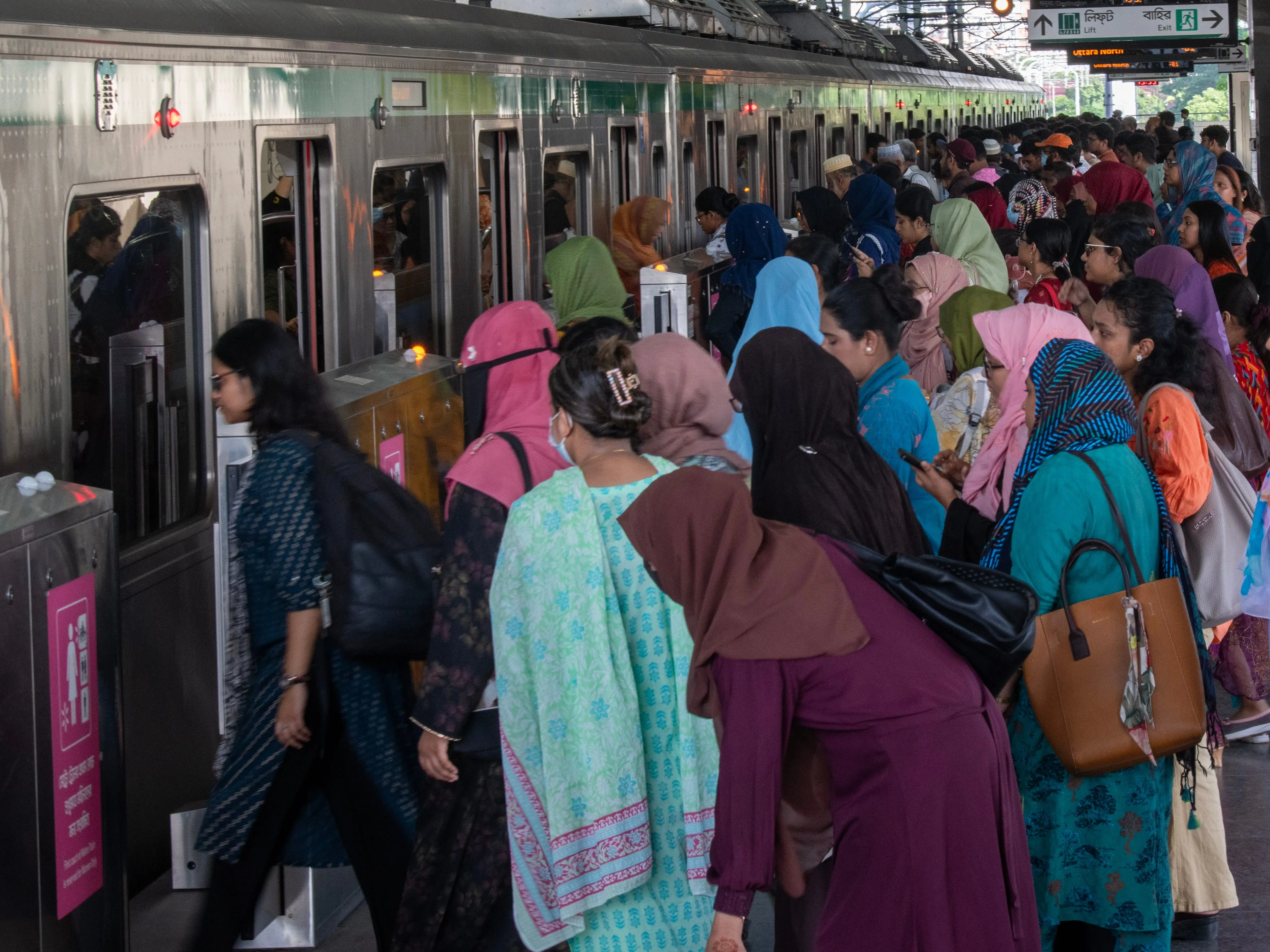 People enter a train in Dhaka, Bangladesh.