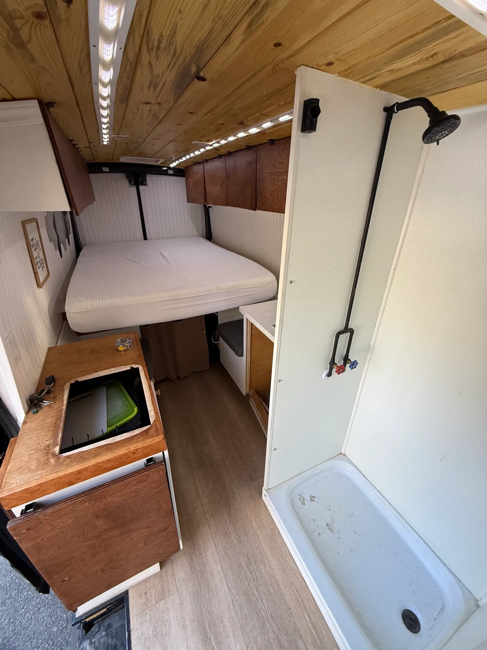 The interior of a van that has been refurbished into a living space.