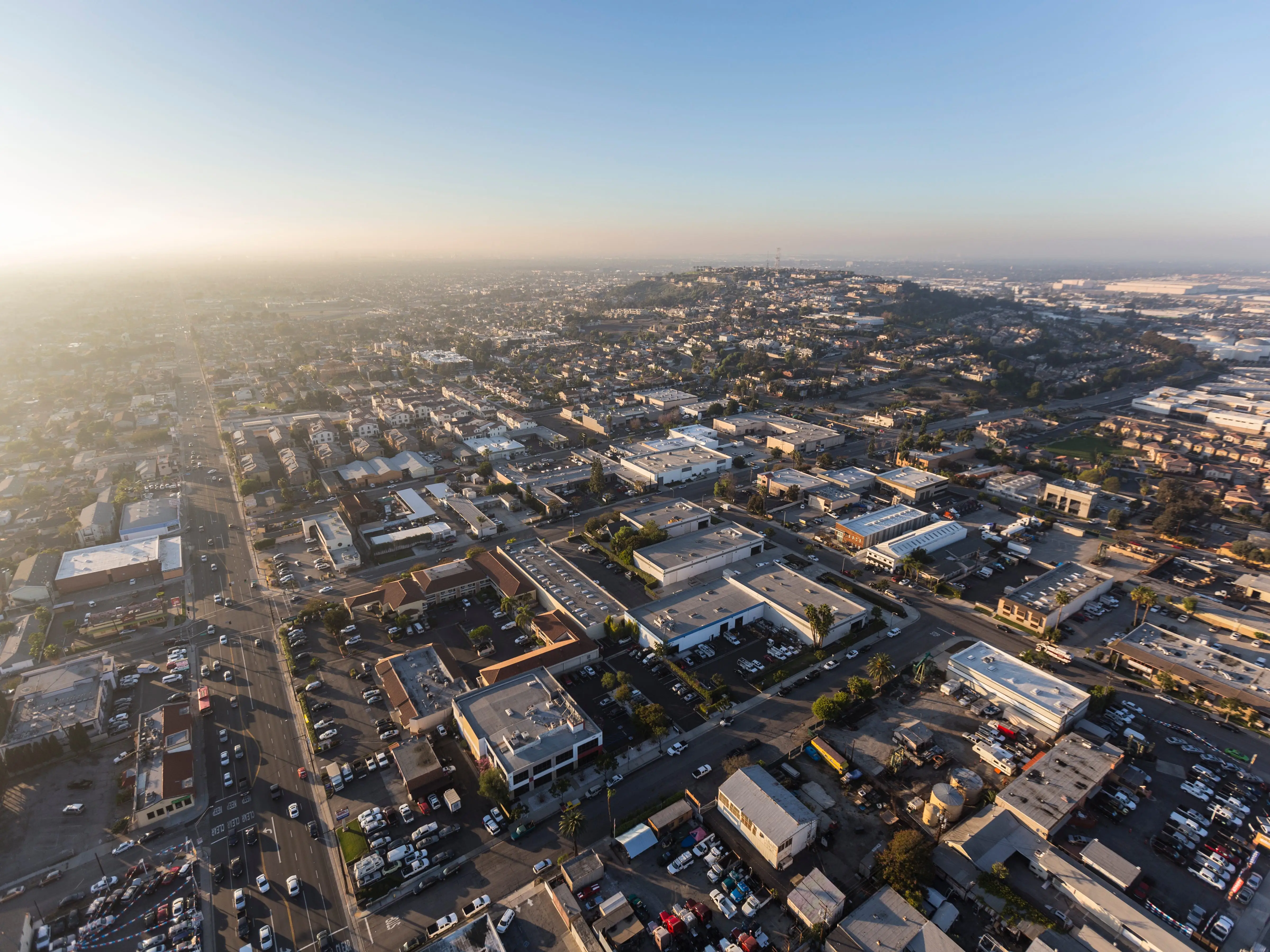 Long Beach, California, USA - January 11, 2018:  Foggy afternoon aerial view of buildings and streets near Signal Hill.