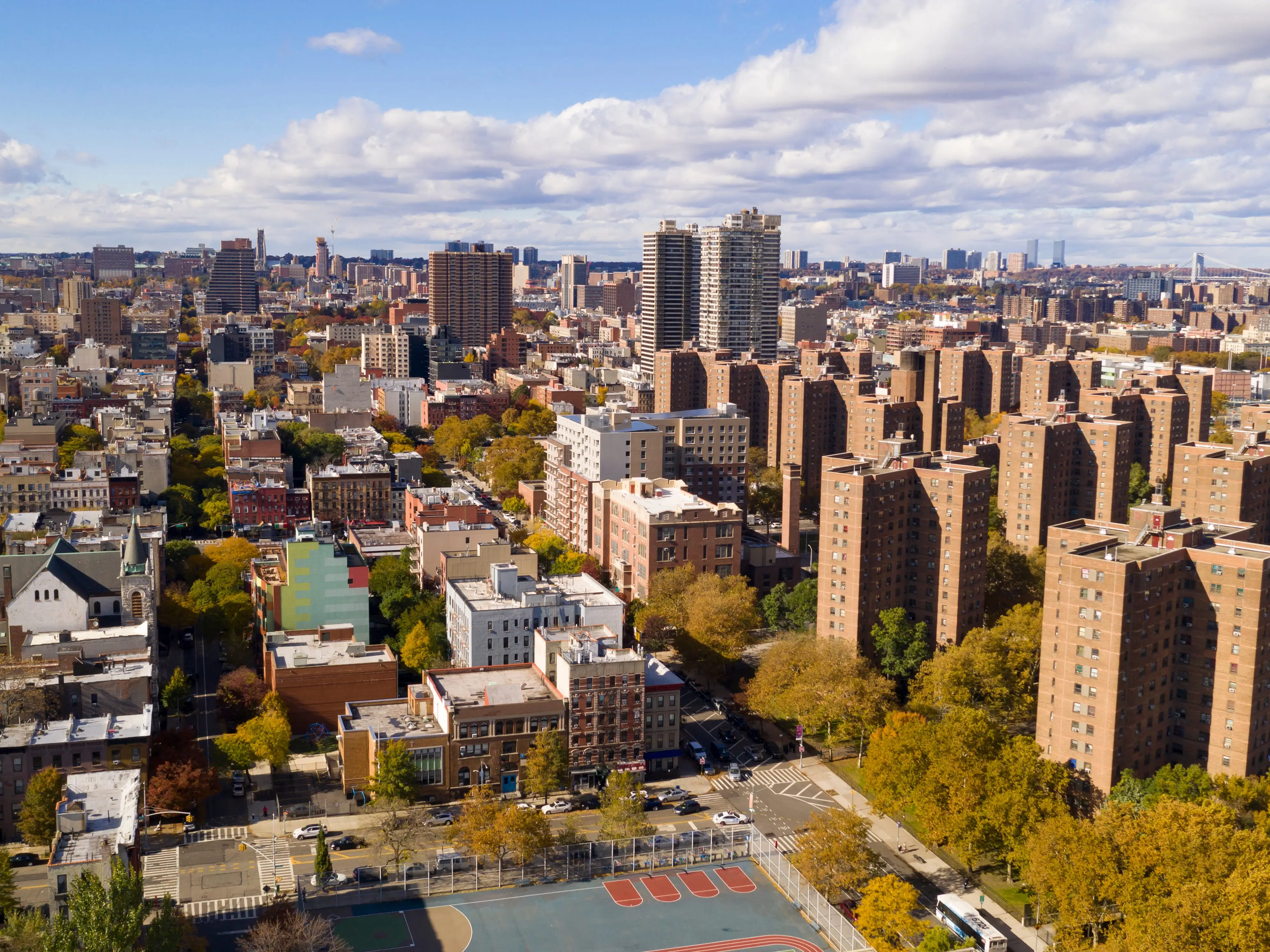 Aerial view over the far north on Manhattan Island in and around Harlem NY