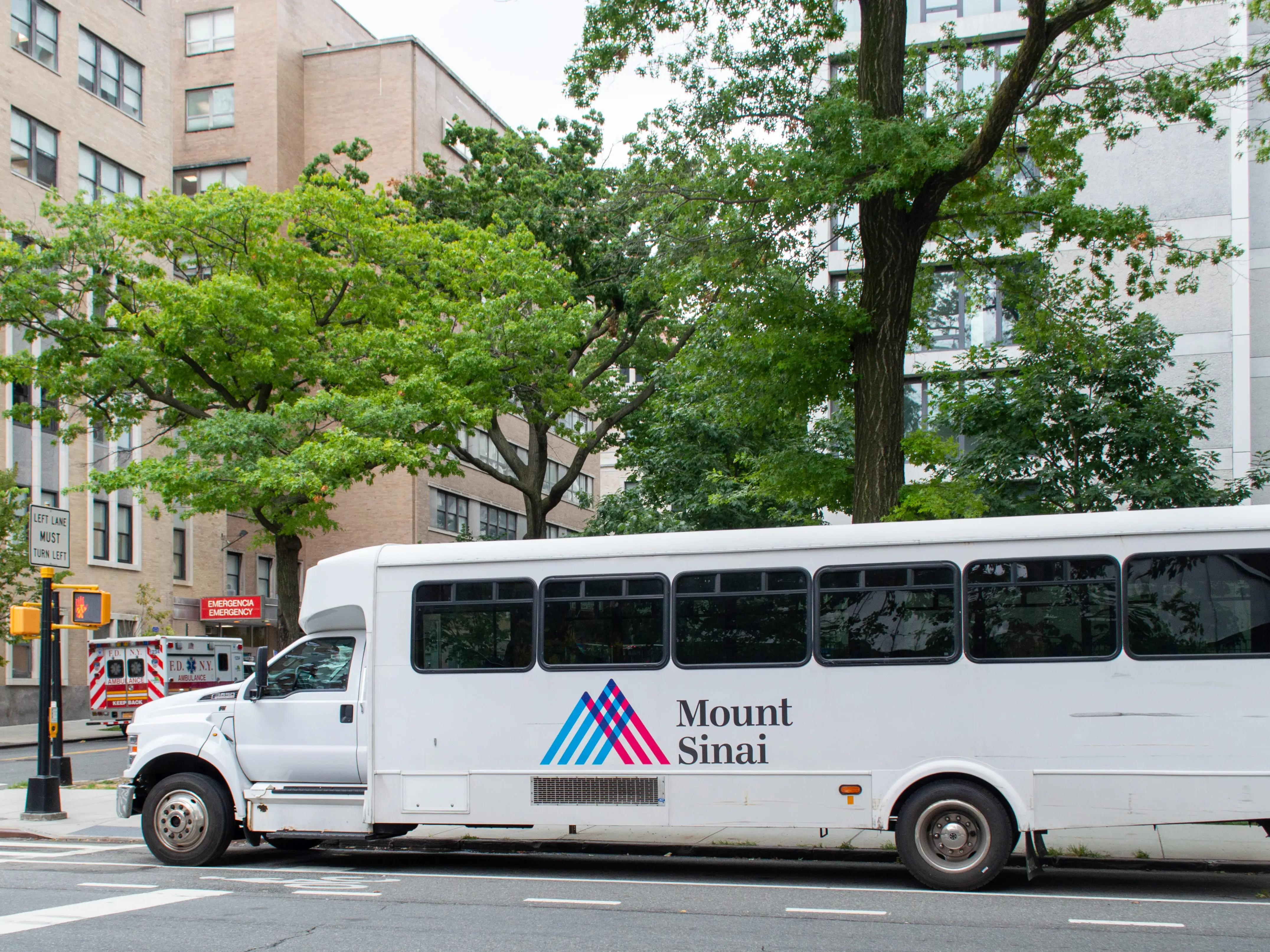 Morningside Heights, New York, NY, USA - August 19, 2021: Mount Sinai medical transport bus parked near hospital on Amsterdam Ave