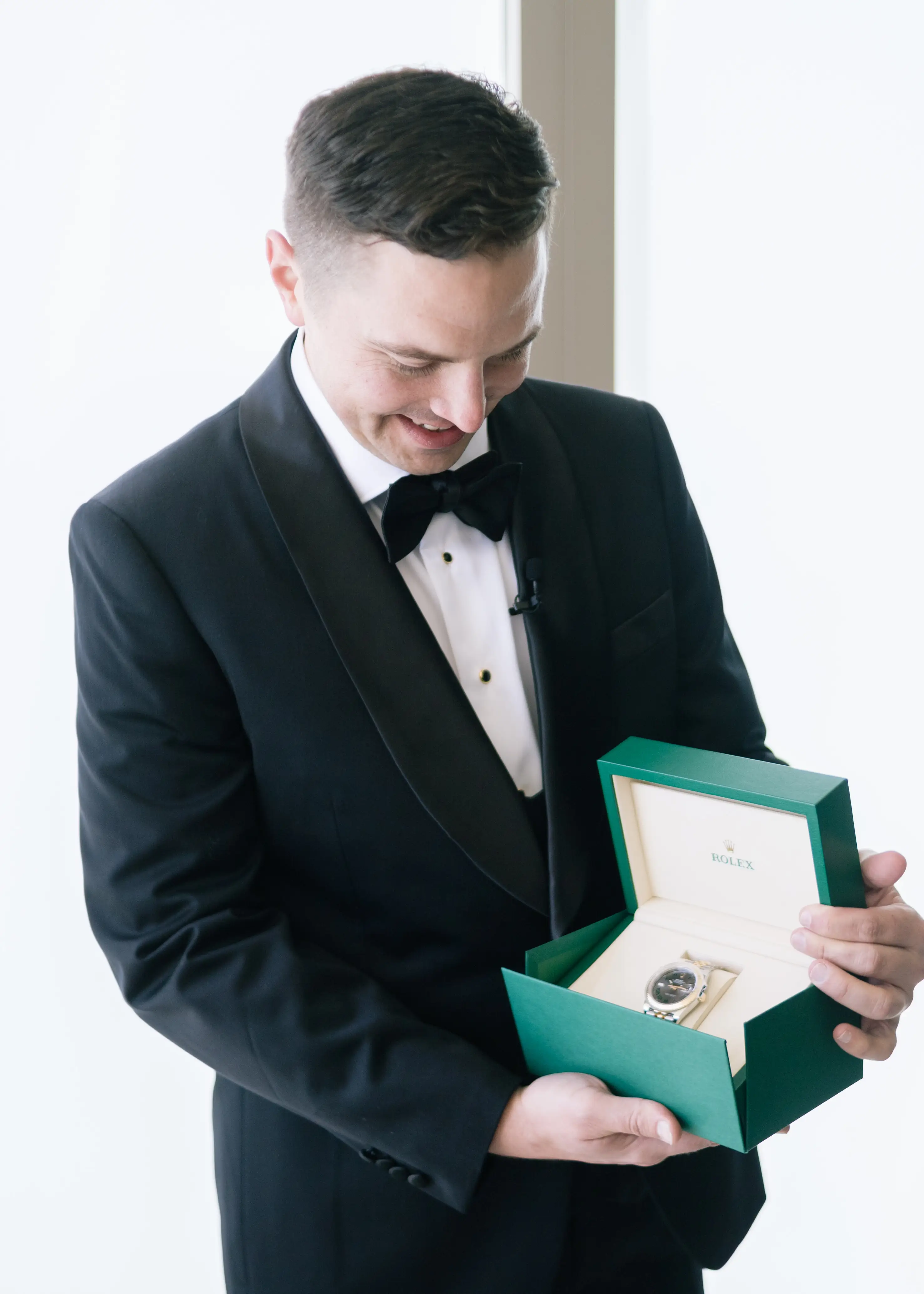 Christopher Kopinski looks at his Rolex.