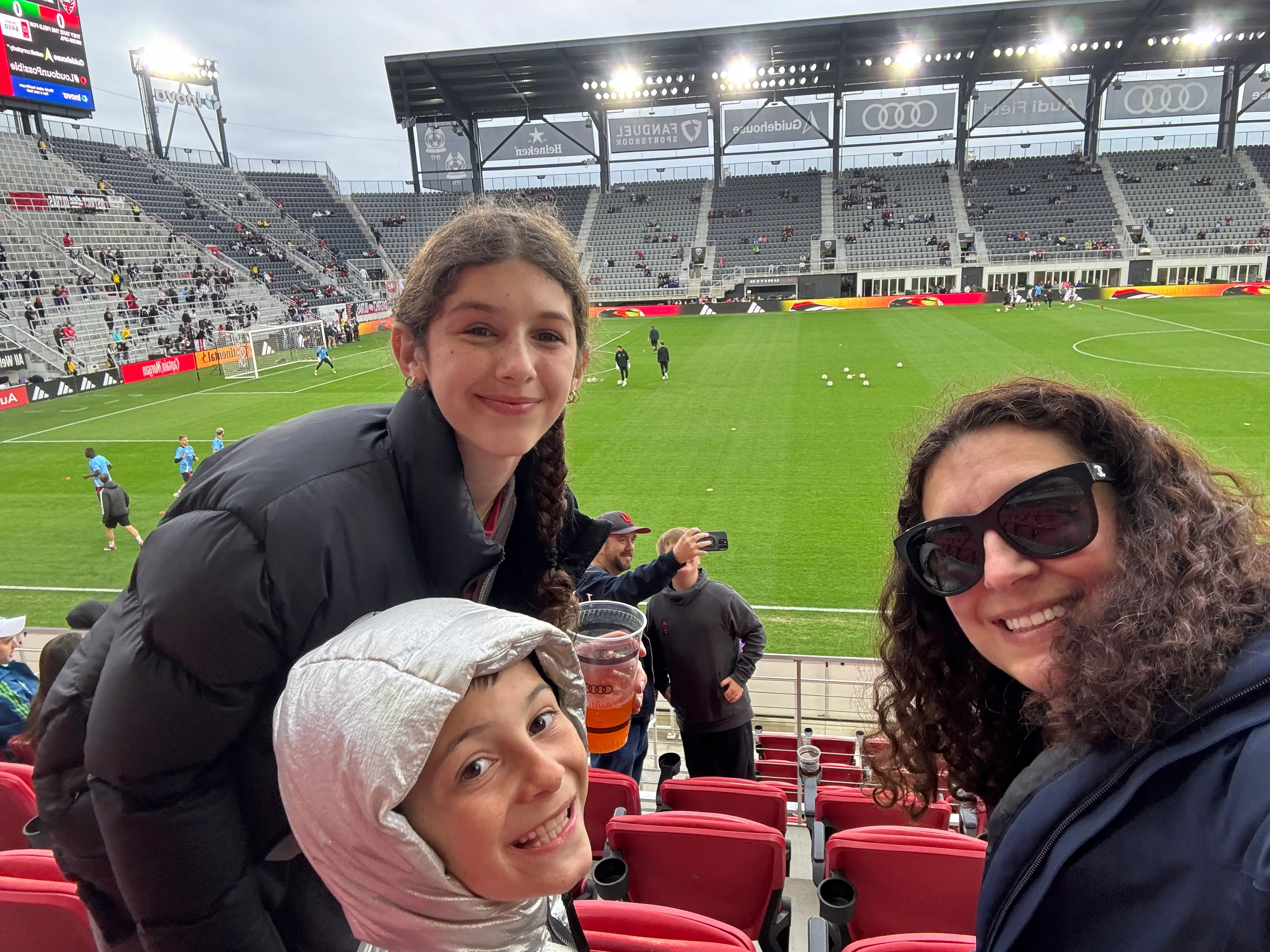 The author iwth two of her kids at a soccer game.