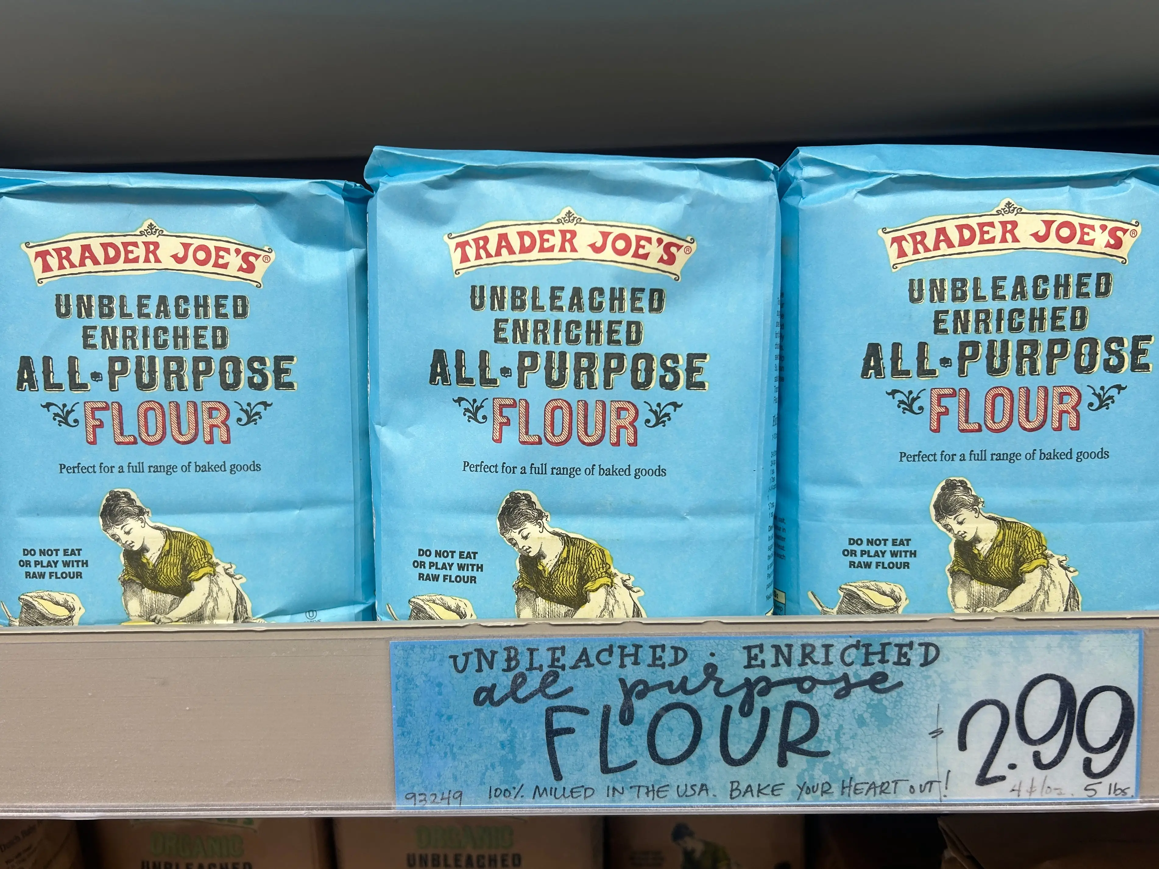 Several bags of Trader Joe's unbleached enriched all-purpose flour.