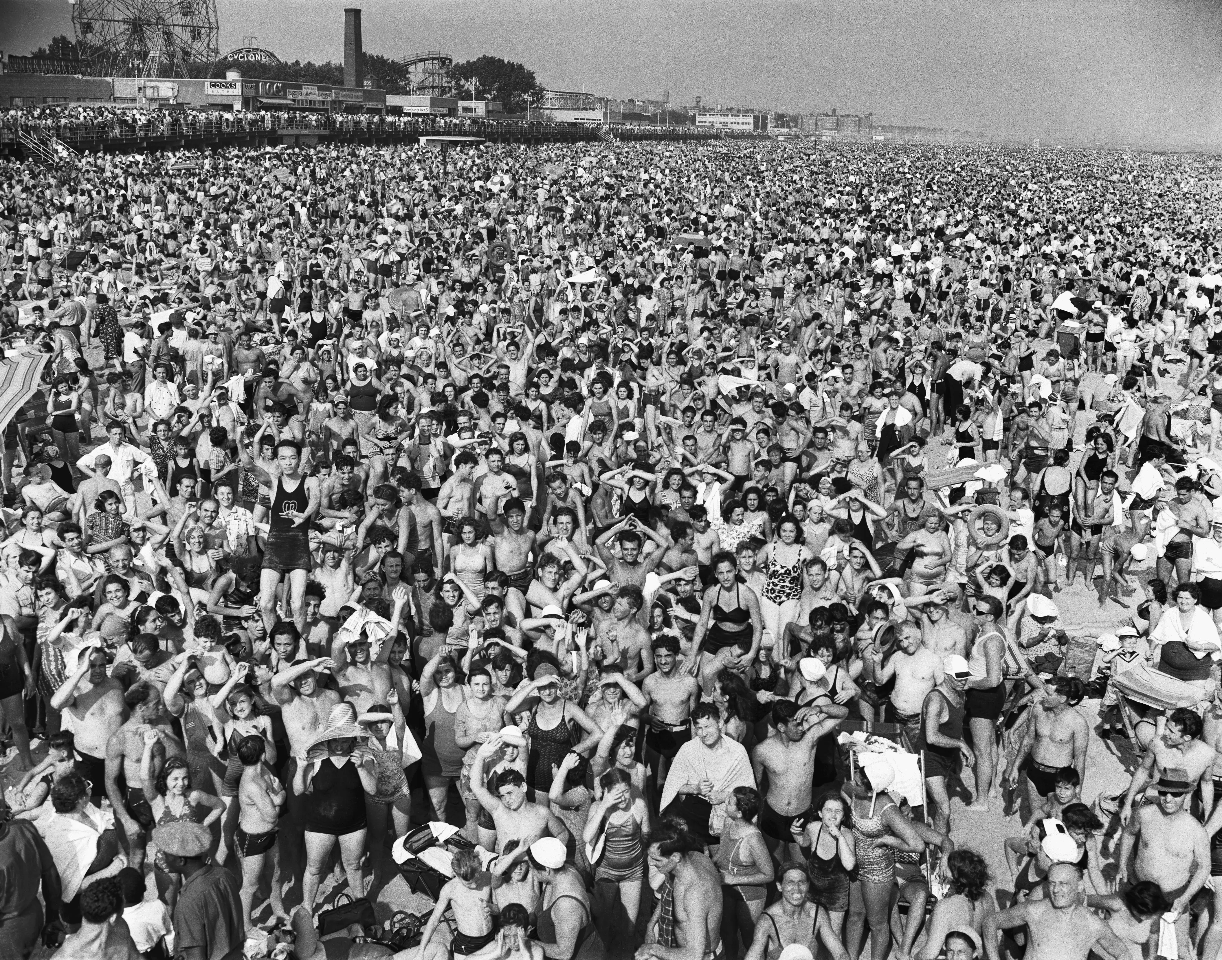 A black and white photo of a crowd at Coney Island in 1940.