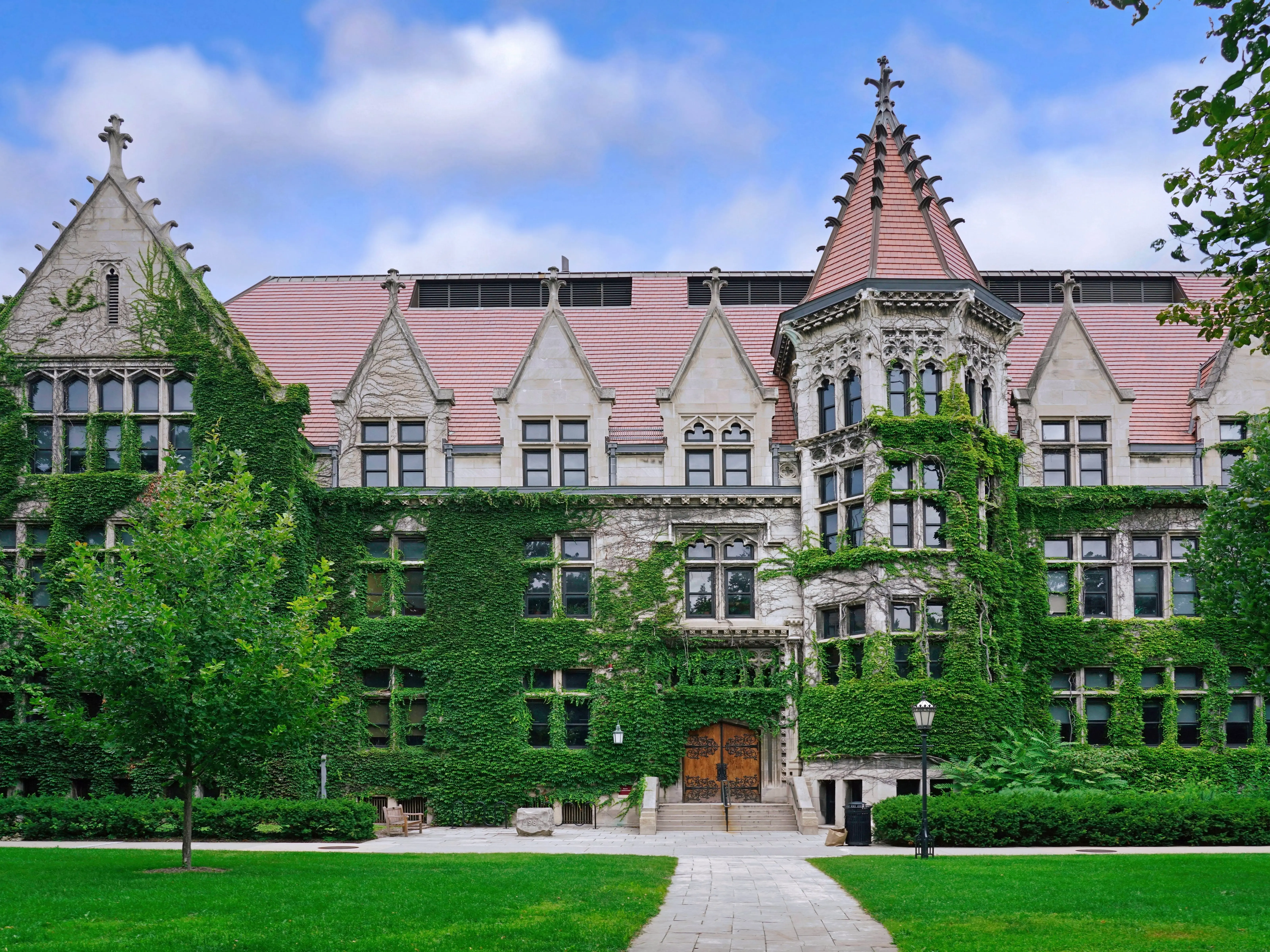 Chicago, USA - August 2022:  An ivy covered gothic style building typical of the architecture of the older section of the University of Chicago on its main quadrangles.