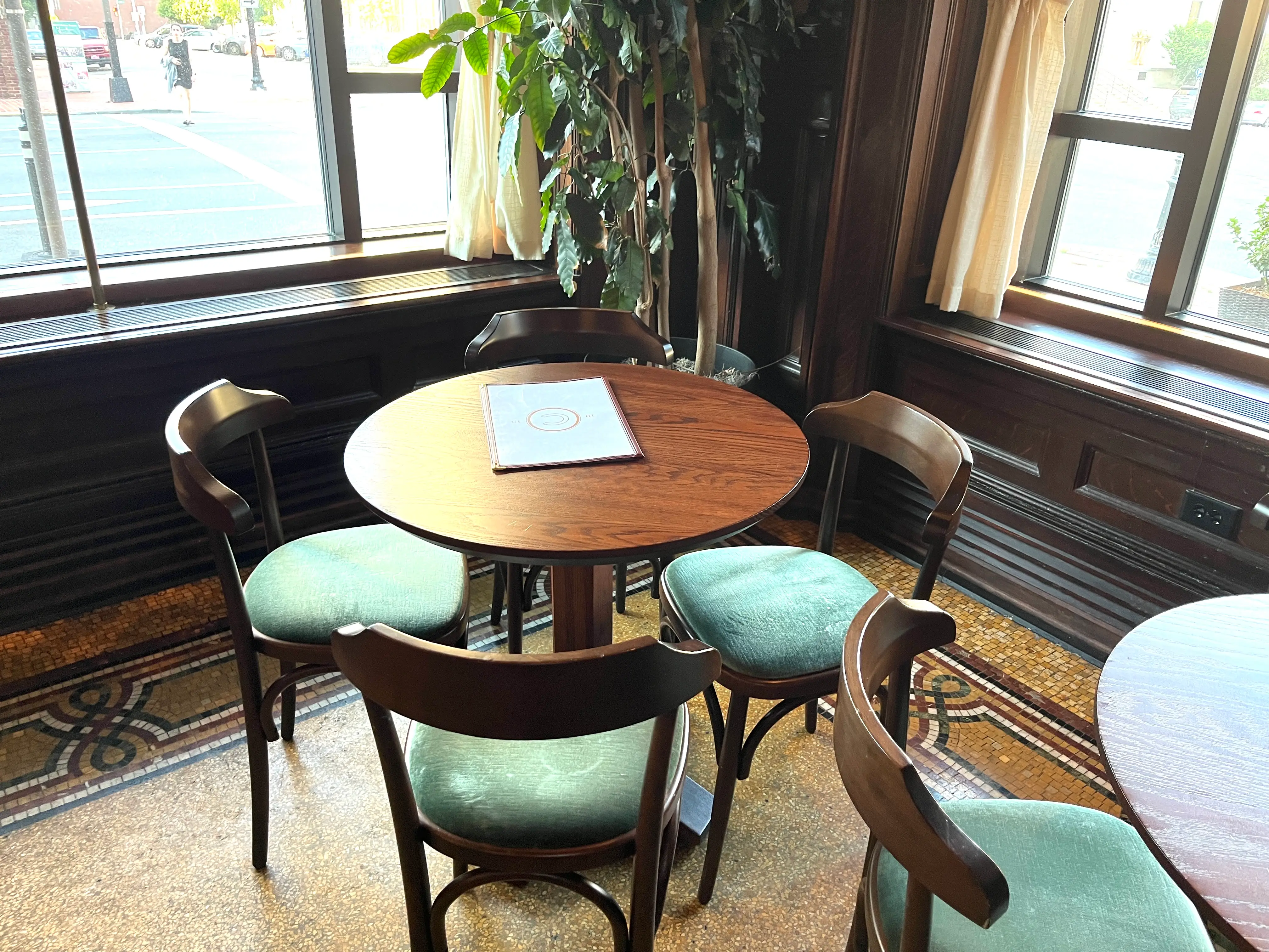 A corner table in the Green Room at Hotel Du Pont.