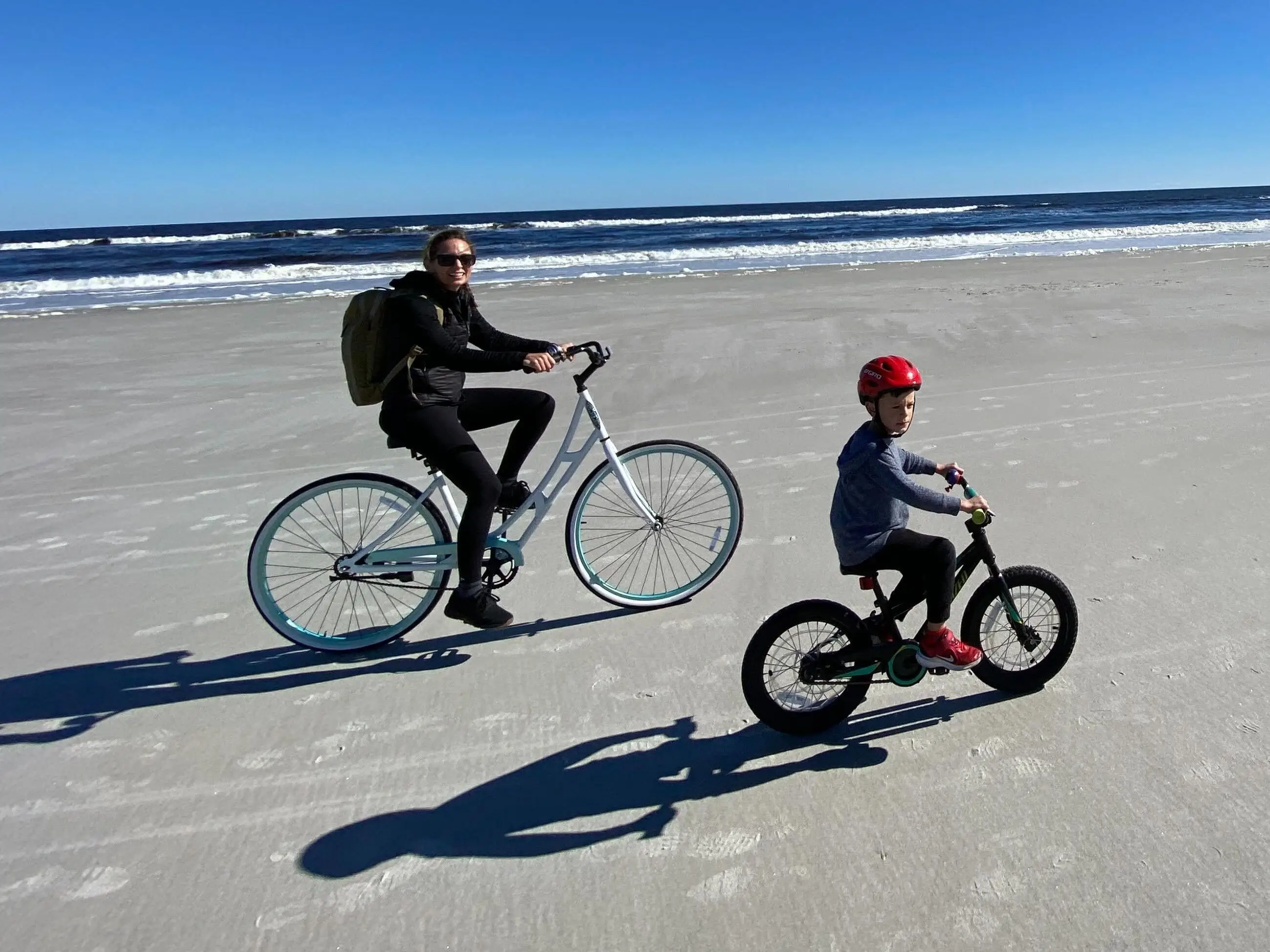 Emily McCarthy biking with her son