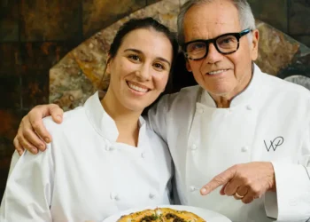I cooked with Wolfgang Puck at Spago. He showed me how to make his famous pizza.