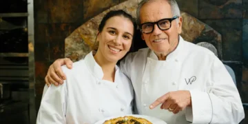 I cooked with Wolfgang Puck at Spago. He showed me how to make his famous pizza.