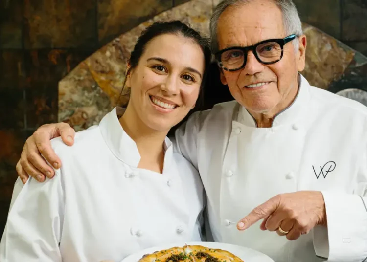 I cooked with Wolfgang Puck at Spago. He showed me how to make his famous pizza.