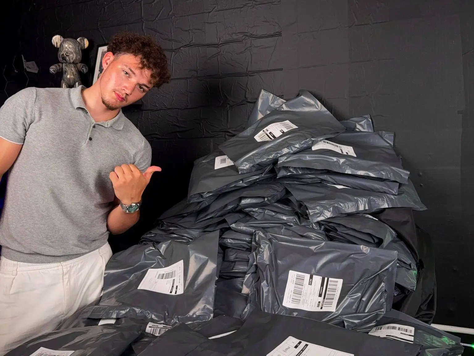 Morgan Purnell stands next to many post packages he has sold.
