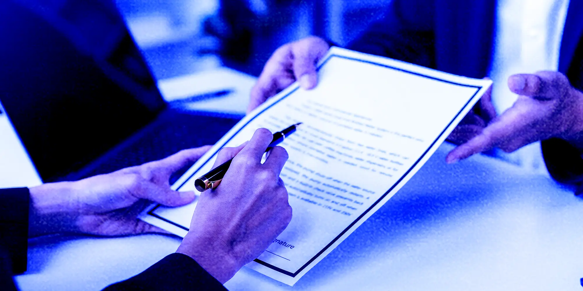 Interviewer holding a paper résumé.
