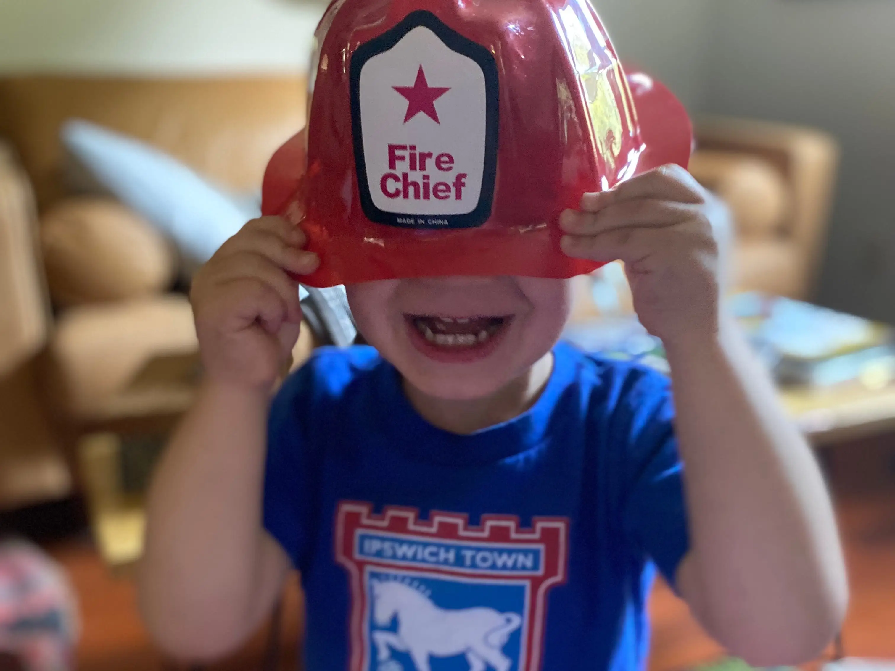 Boy with Fire Chief helmet