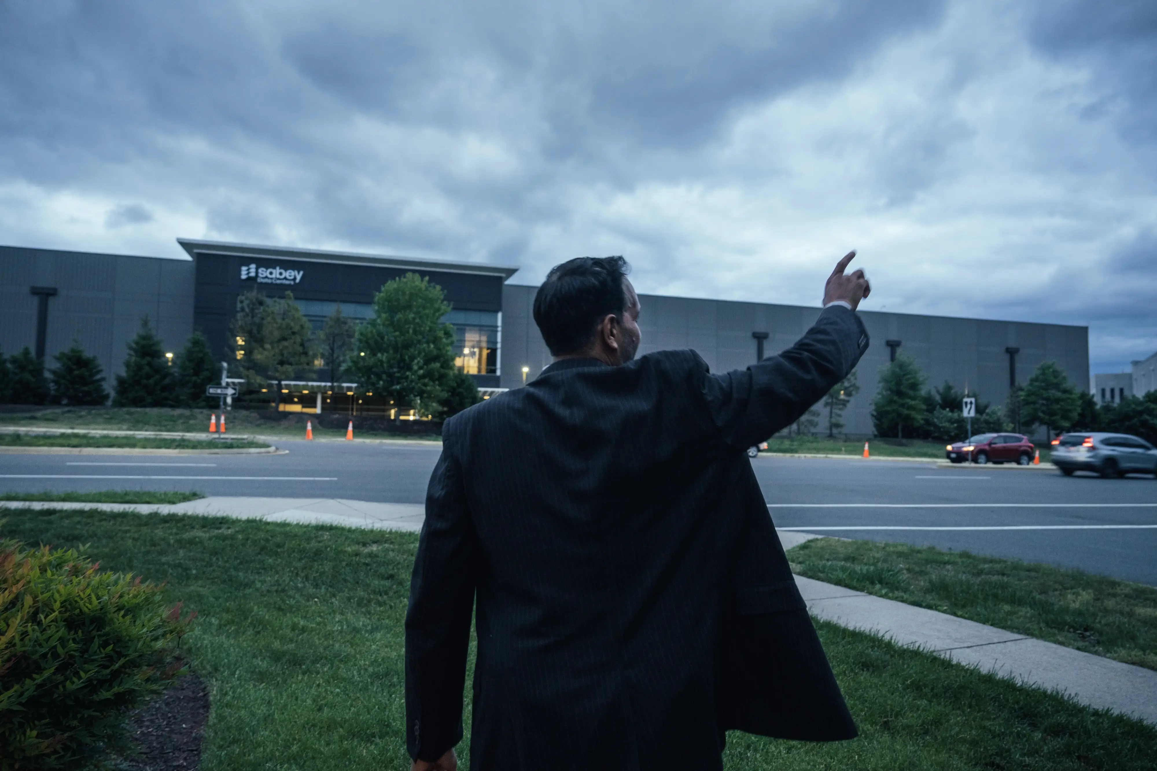 Mital Gandhi points out nearby data center construction from The Regency, the community where he lives in Ashburn, Virginia in the heart of Data Center Alley.
