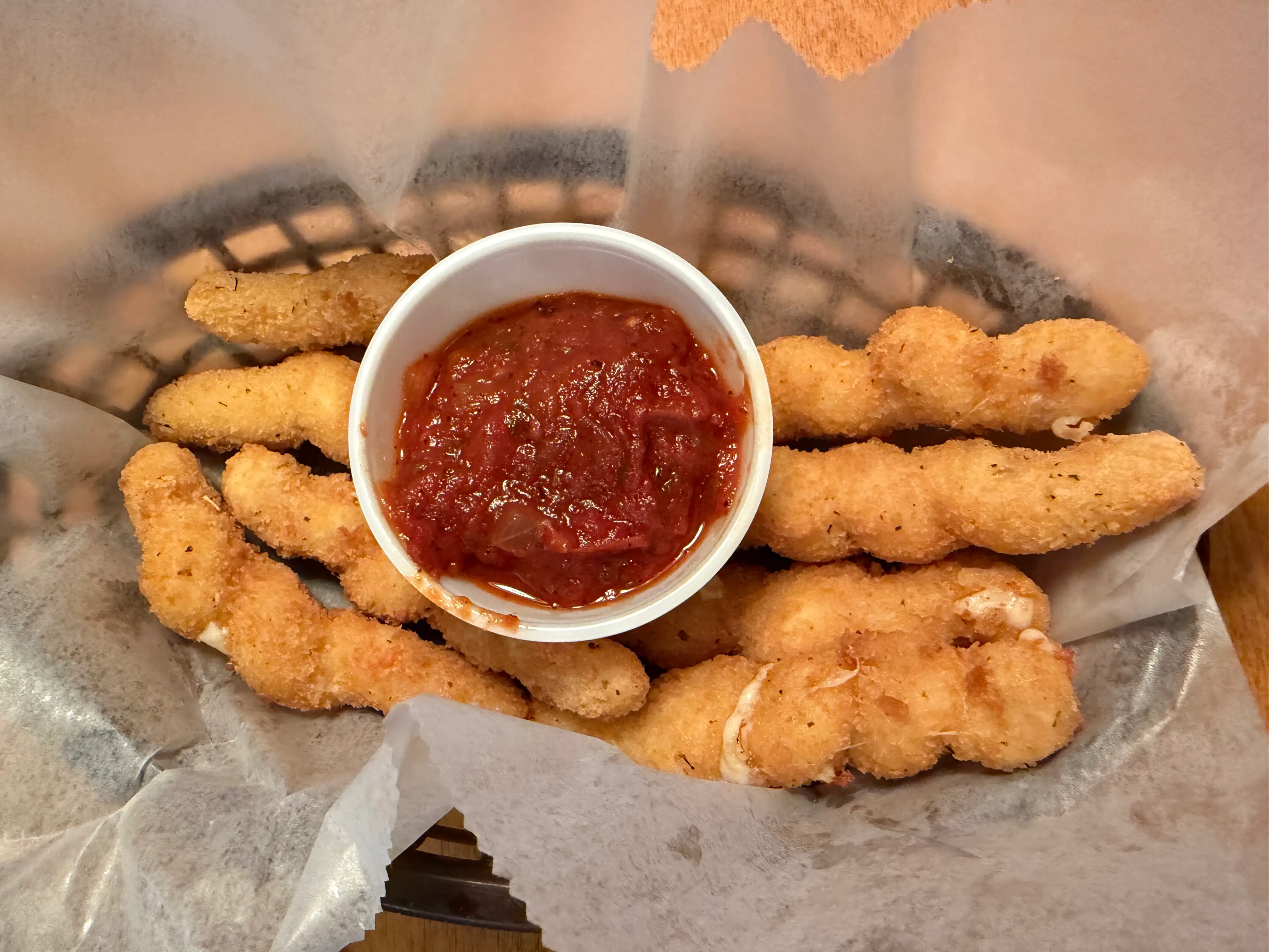 Mozarella twists with sauce container at Texas Roadhouse