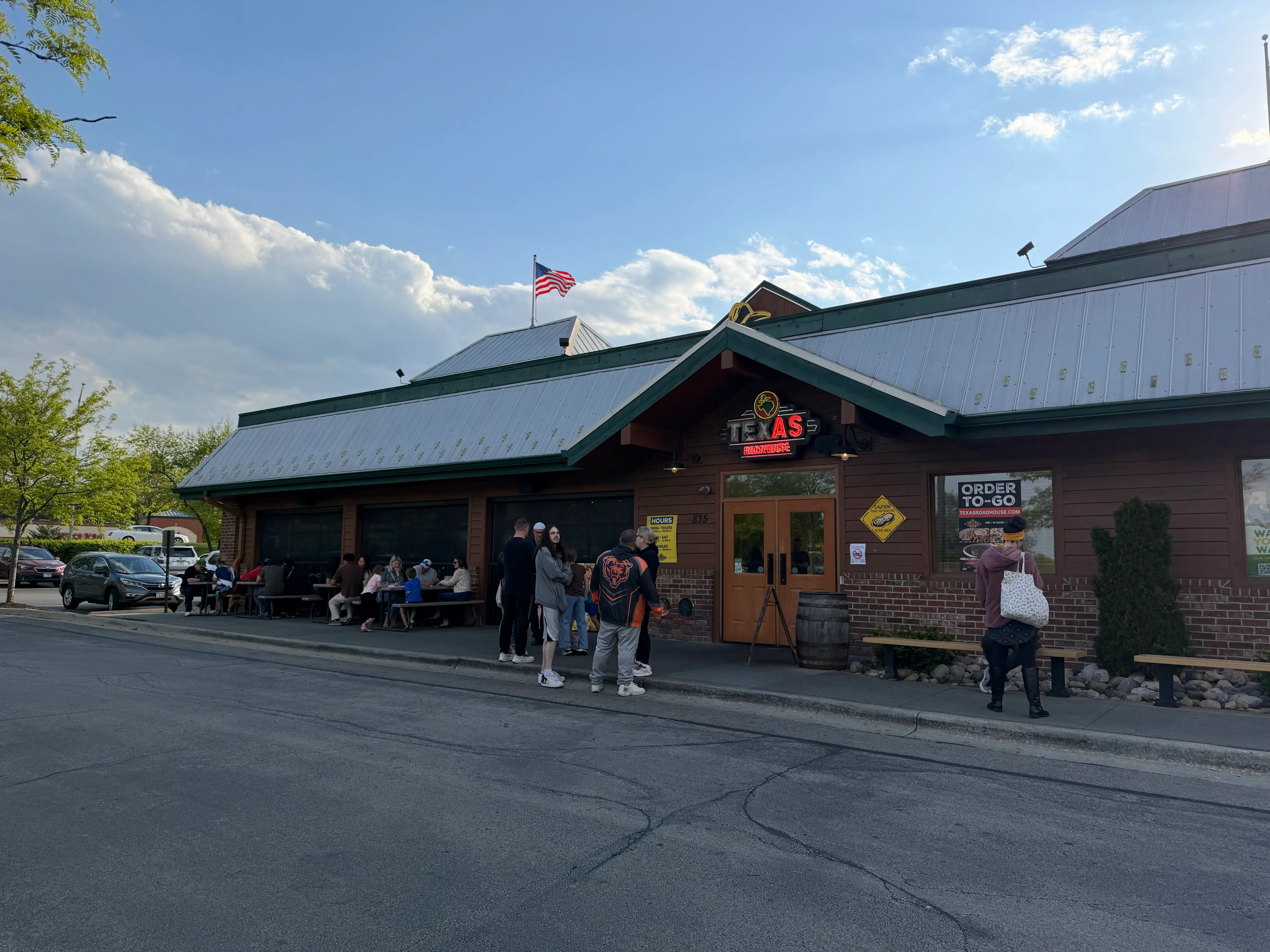 Groups of people outside of a Texas Roadhouse location