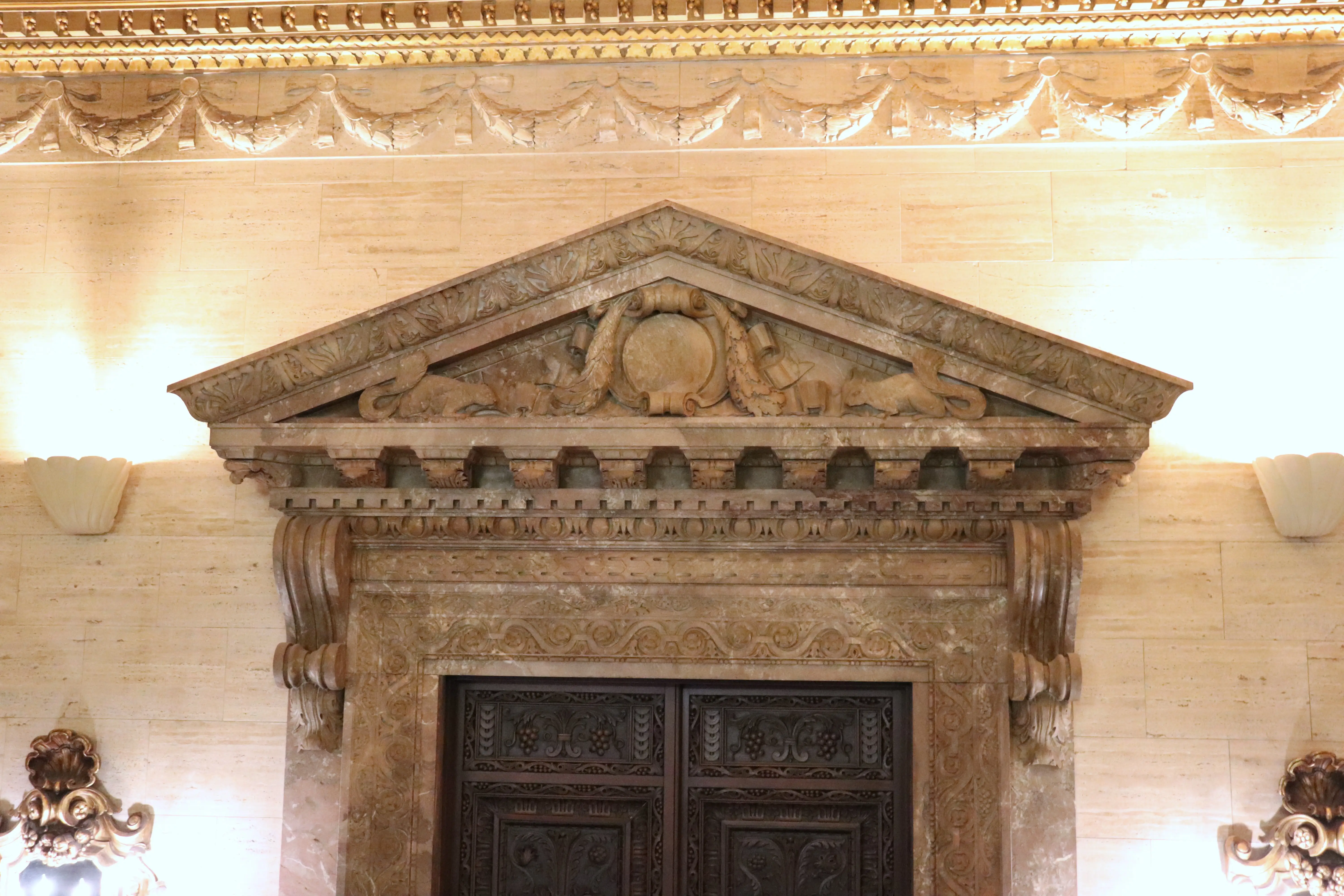 Squirrels above the door leading to the lobby.