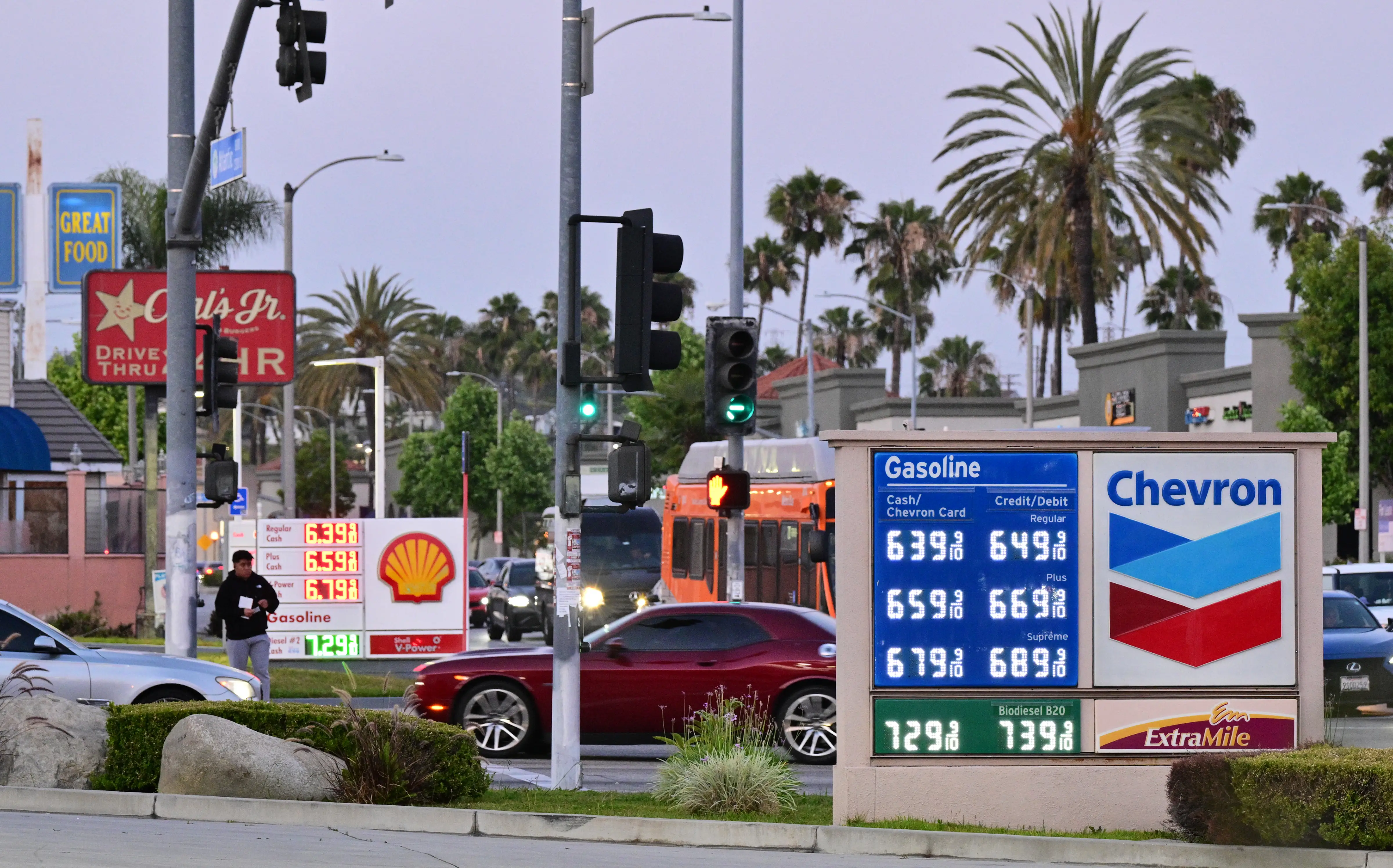 Gas prices above $6 per gallon are displayed at Chevron and Shell stations