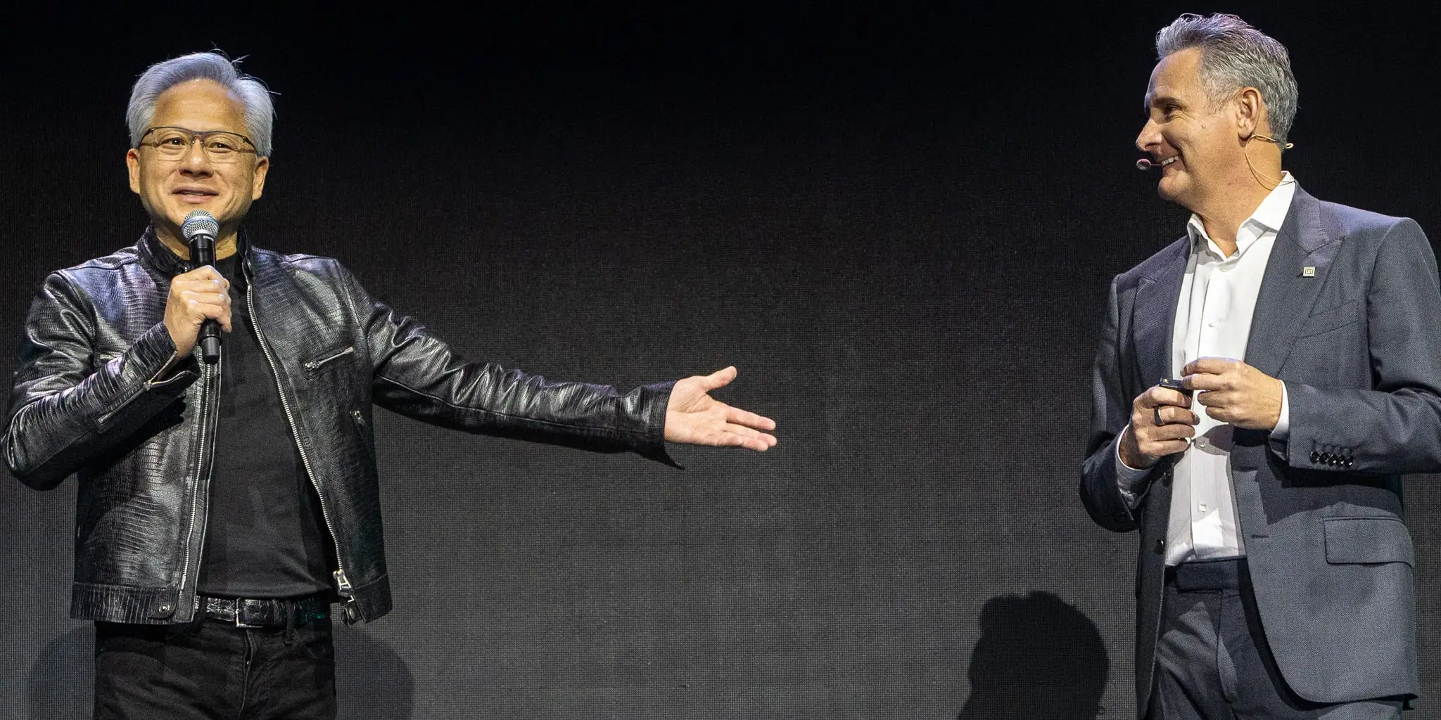Nvidia CEO Jensen Huang gestures towards Matthew Murphy, boss of Marvell Technologies.