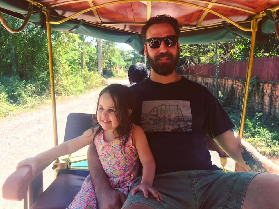 Dad and daughter in TukTuk