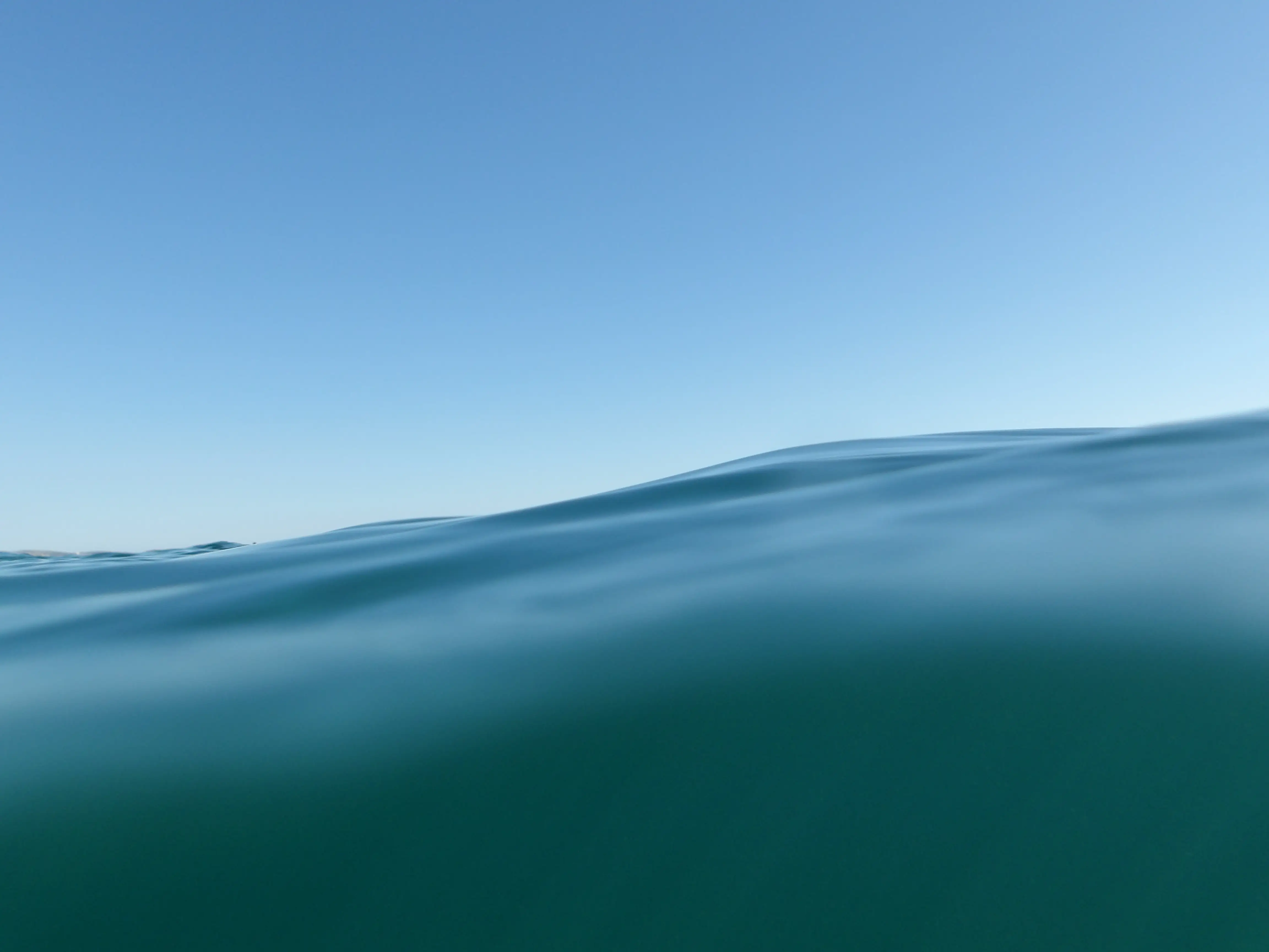 A blue wave in the ocean.
