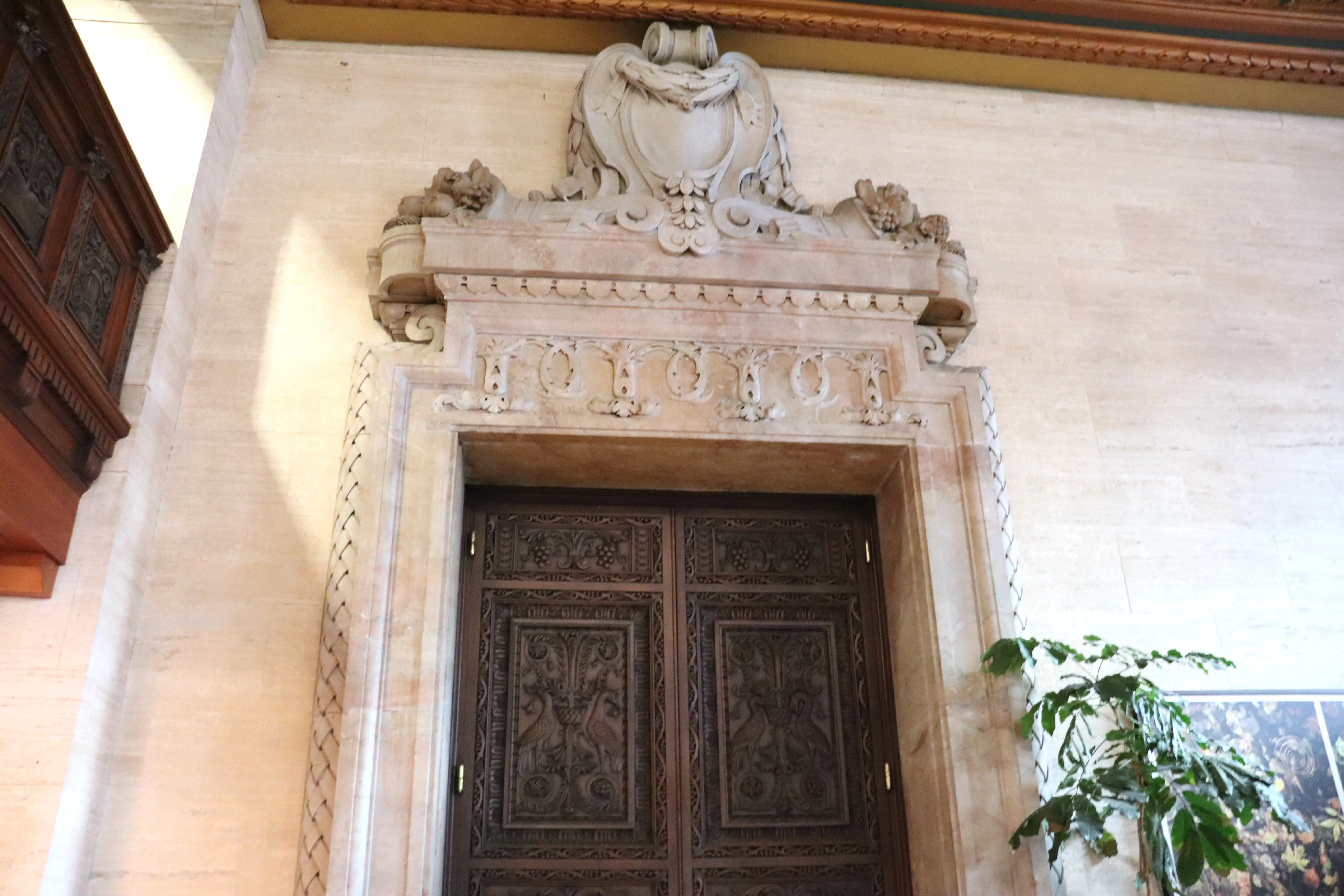 A horn of plenty above a door at Hotel Du Pont.
