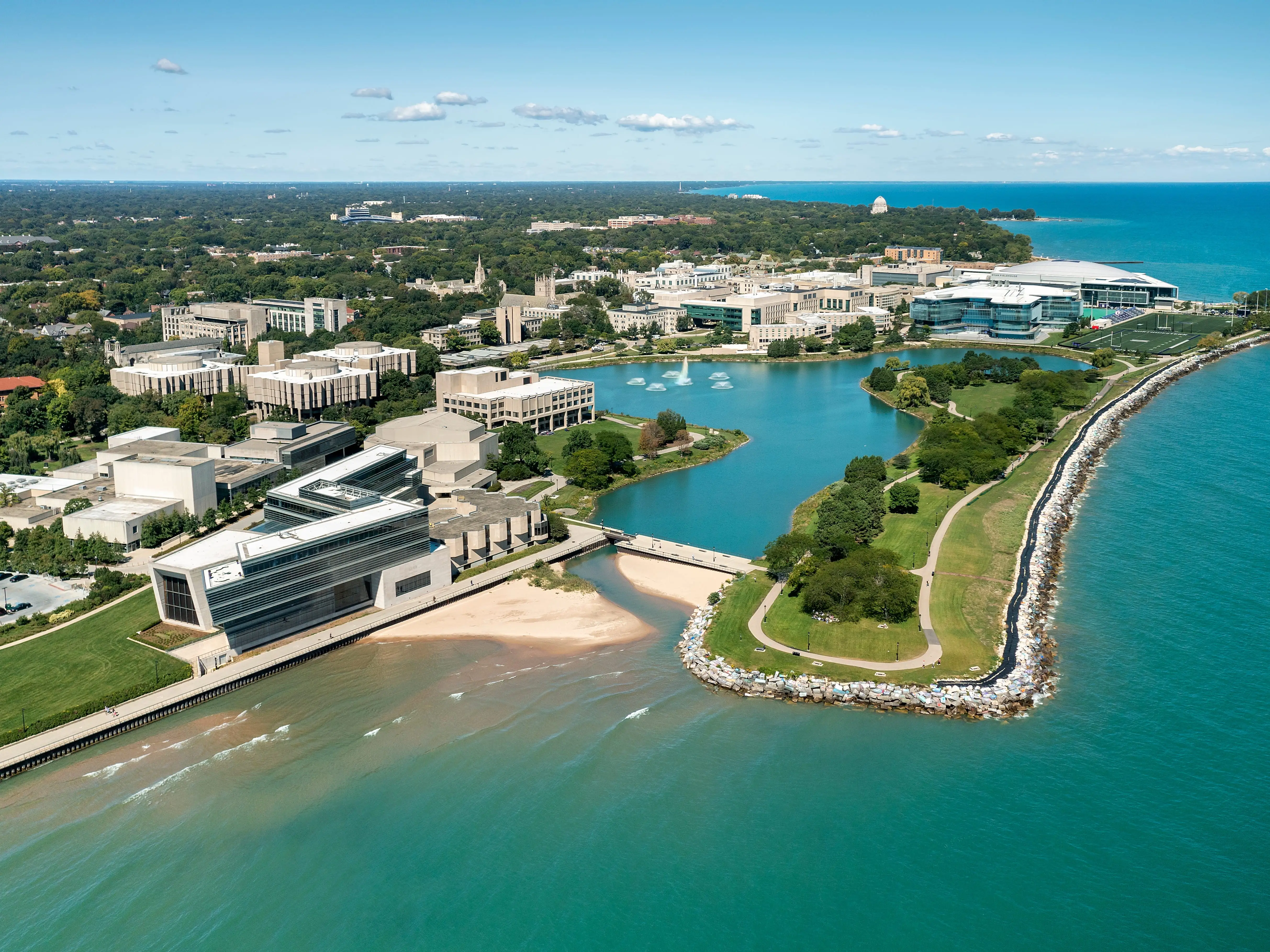 EVANSTON, IL — SEPTEMBER 9, 2021: Aerial view of Northwestern University and Lake Michigan with foreground beach and walking path.