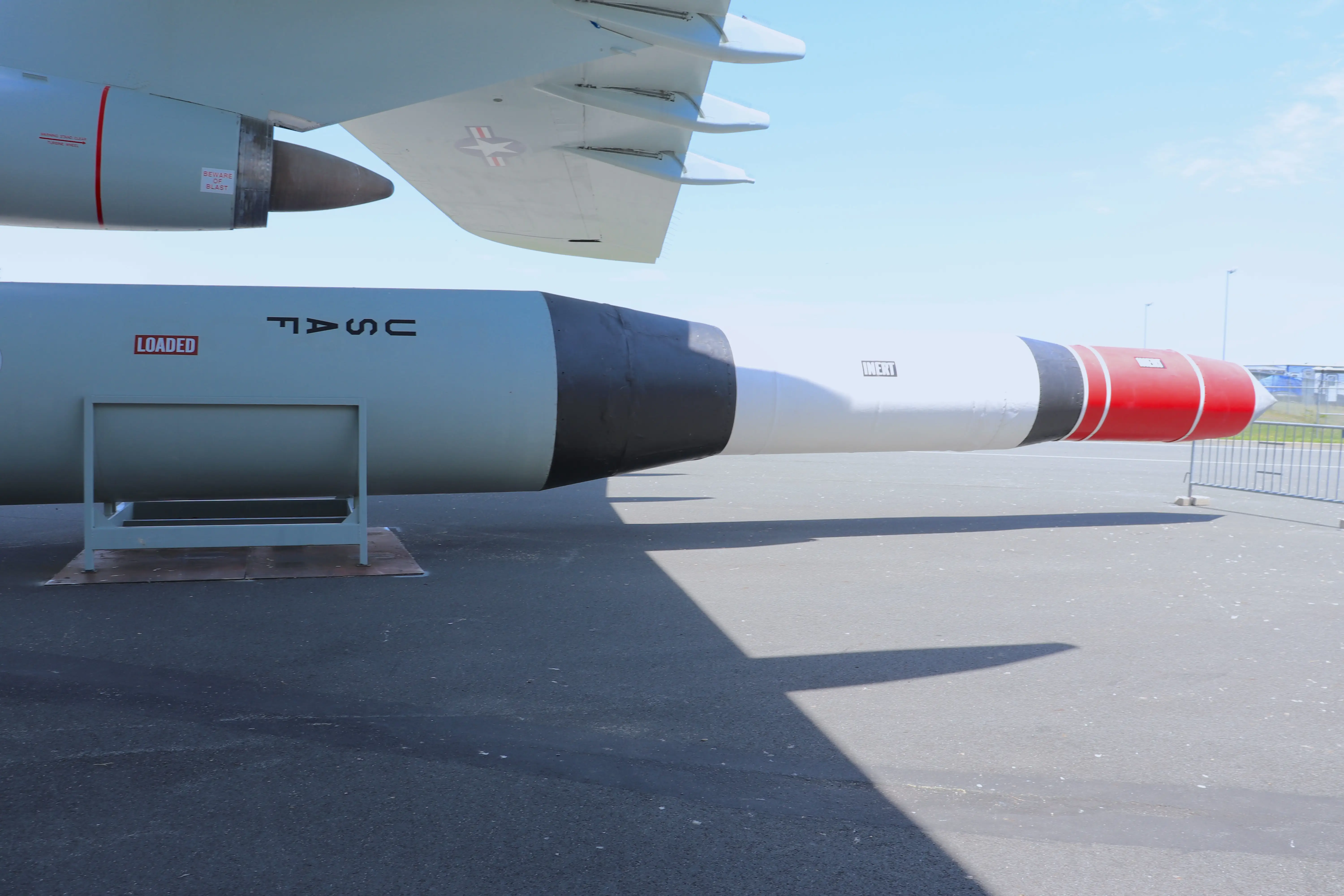An ICBM on display beneath the C-5A Galaxy at the Air Mobility Command Museum.