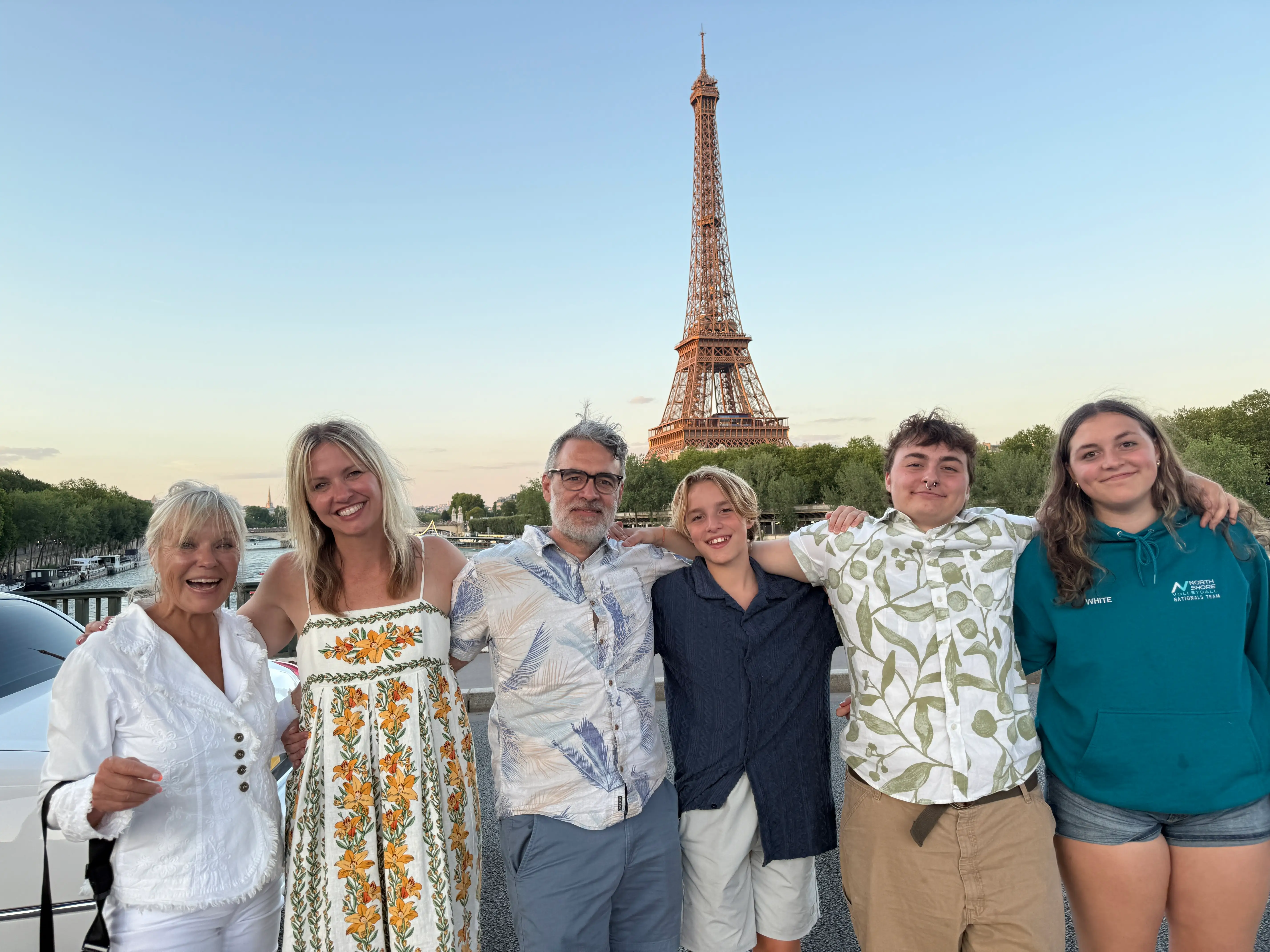 The author (second from left) poses with her family in front of the Eiffel Tower.