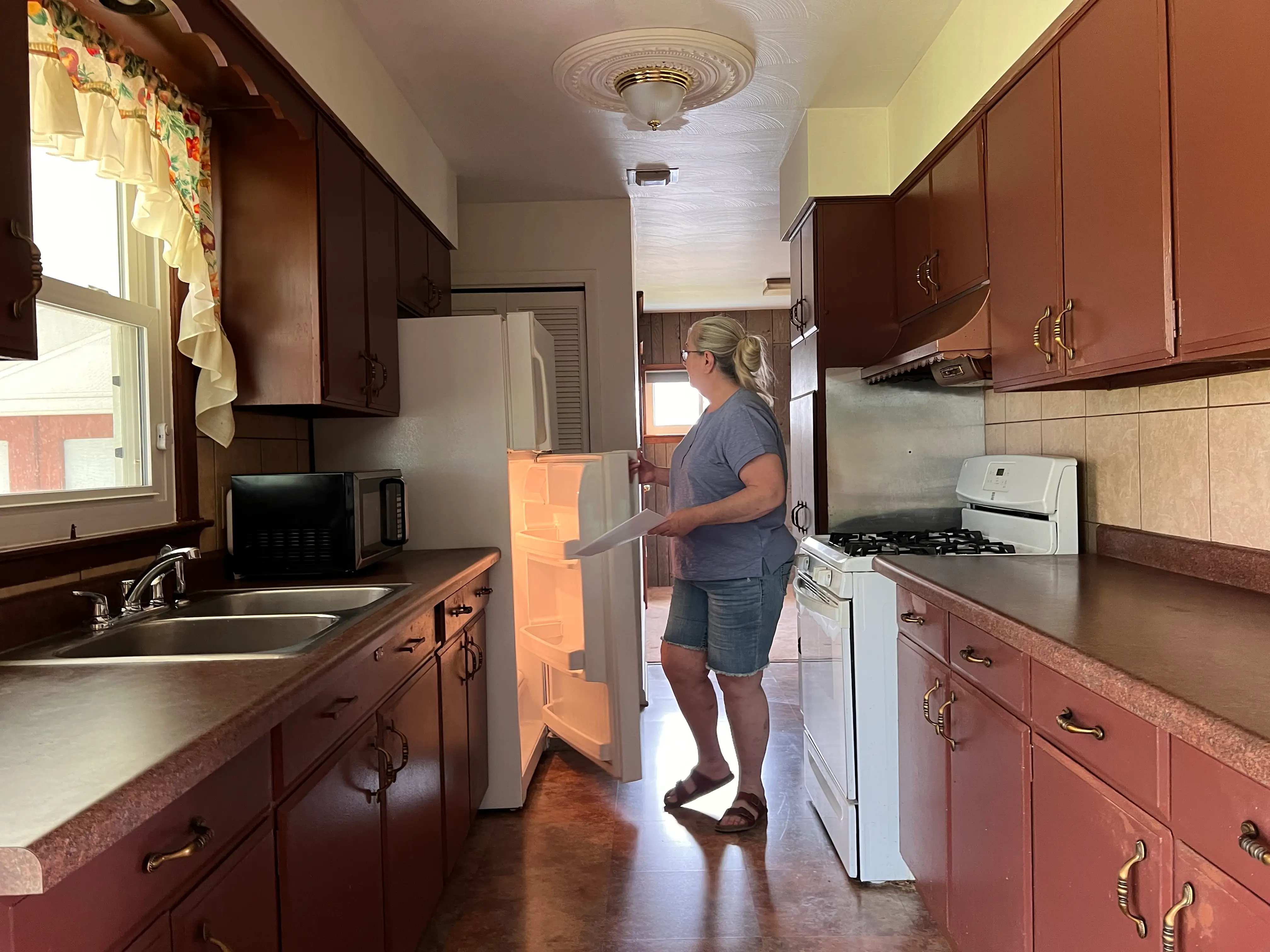 Woman standing in kitchen