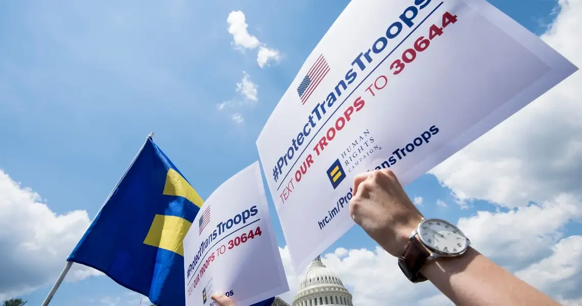 Transgender US troops can continue serving for now, in a major reversal for Trump