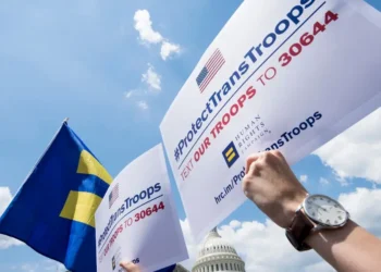 Transgender US troops can continue serving for now, in a major reversal for Trump