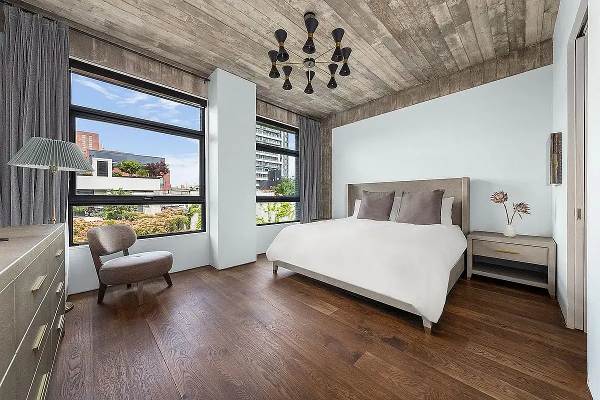 A bedroom of 3 Wythe LN in Brooklyn, a home listed with Anthropic shares as a buying option.