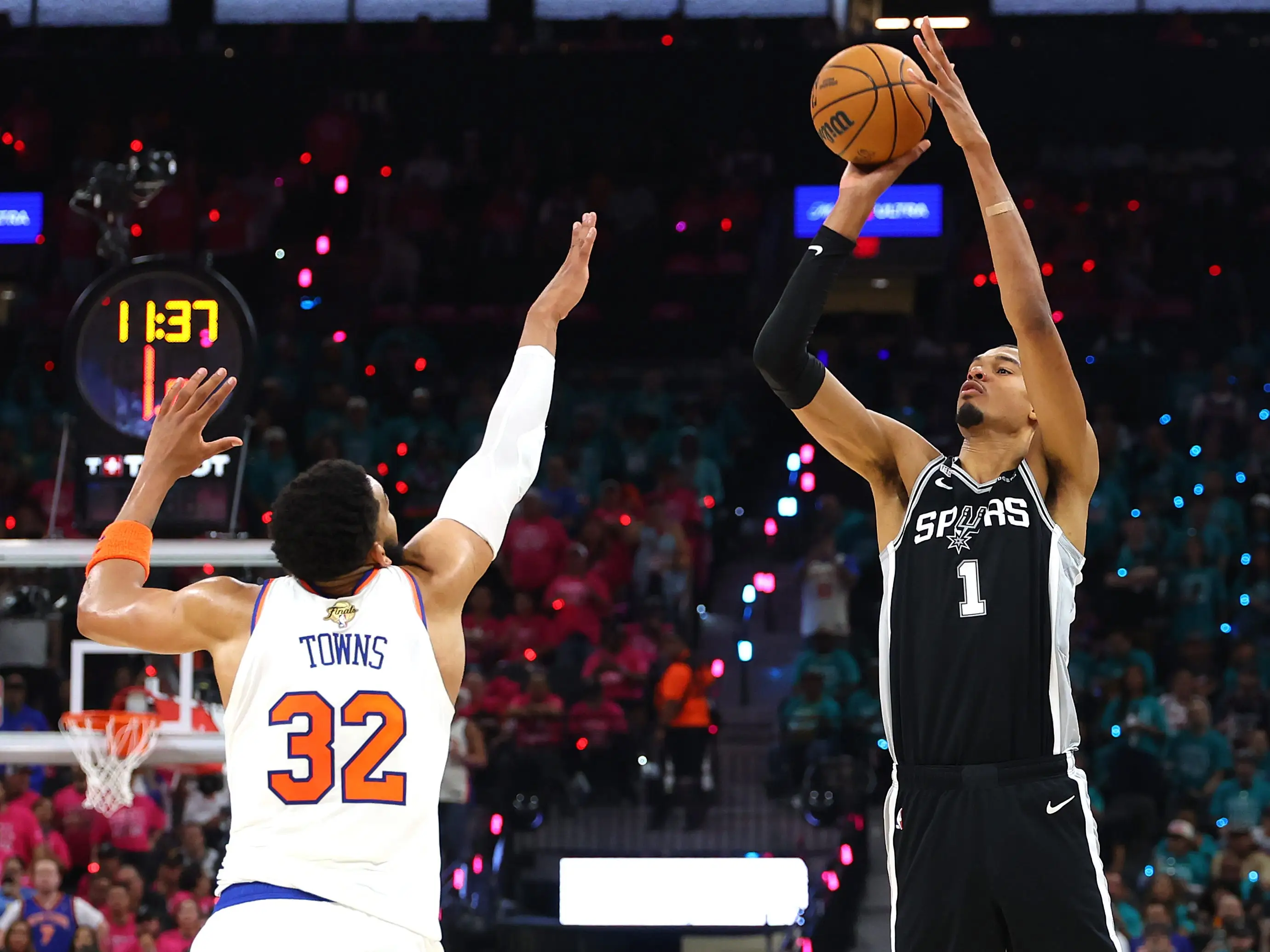 Victor Wembanyama #1 of the San Antonio Spurs shoots the ball against Karl-Anthony Towns #32 of the New York Knicks during the second quarter in Game One of the 2026 NBA Finals at Frost Bank Center.