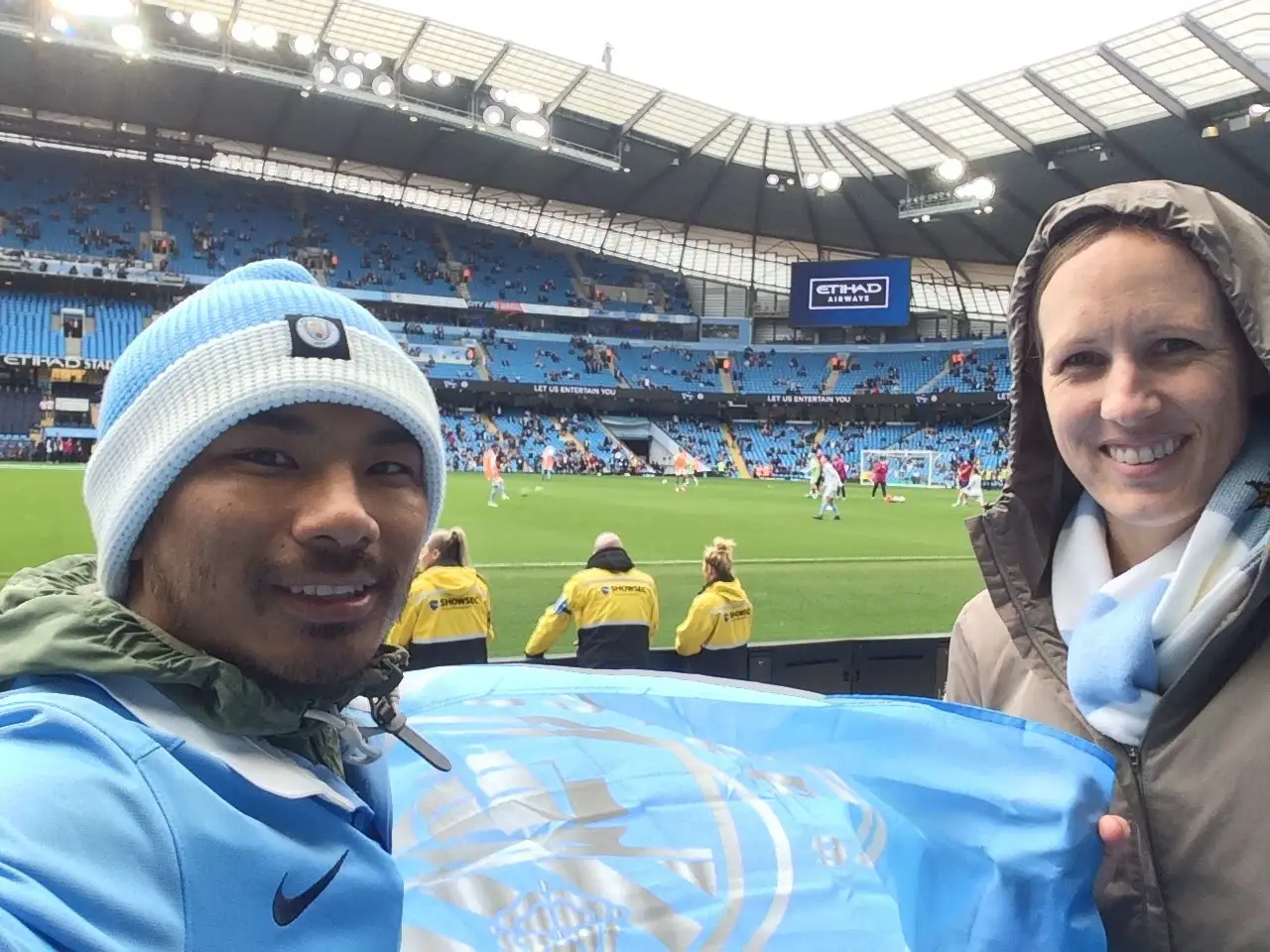 Worchihan in blue hat and jacket at a soccer matach.