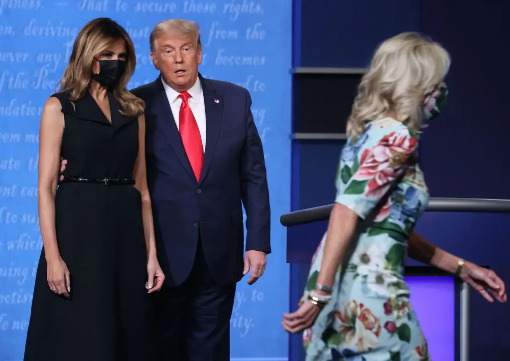 Melania Trump and Donald Trump and Jill Biden at a debate.