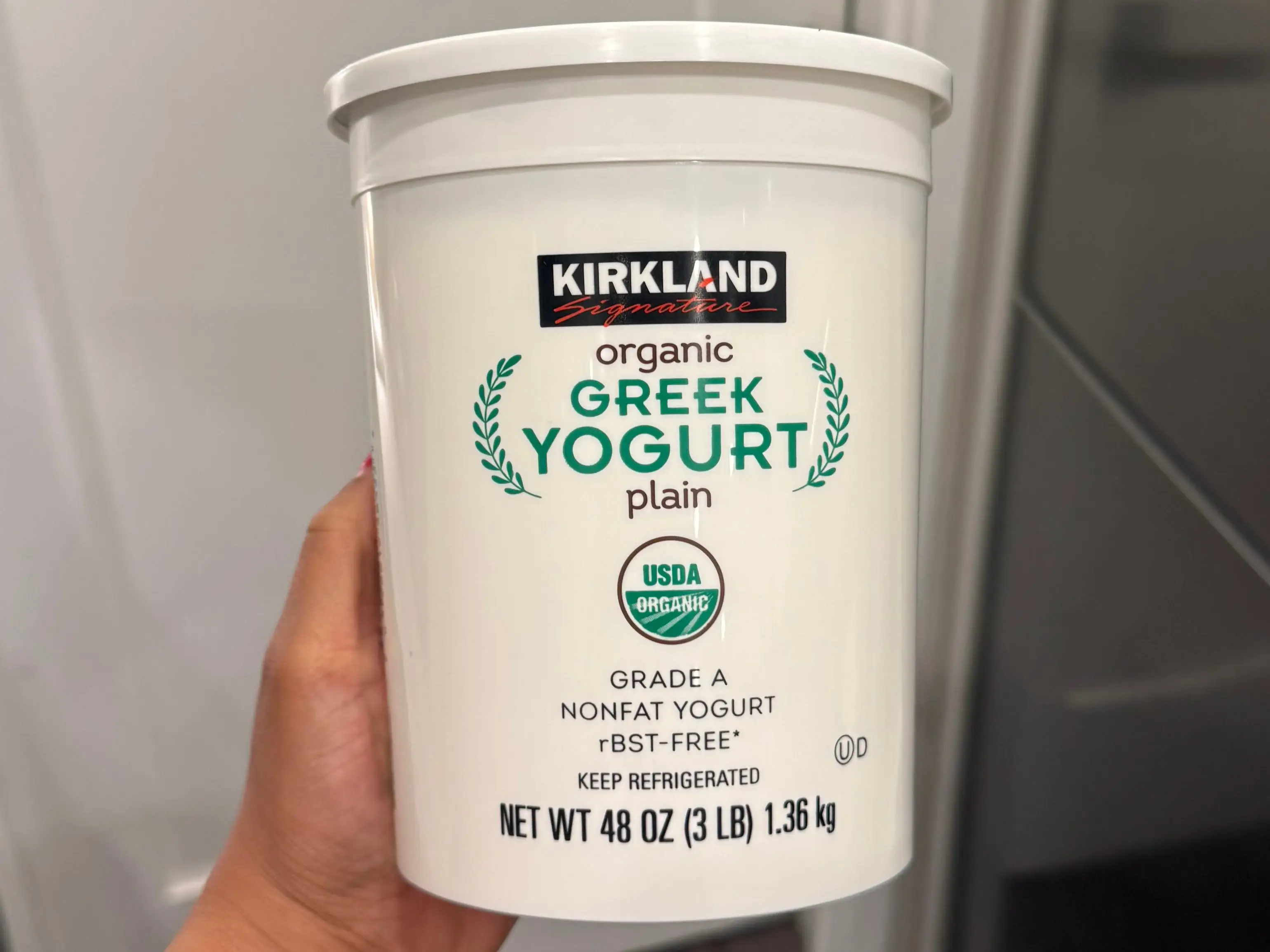 A container of Kirland Signature organic Greek yogurt.