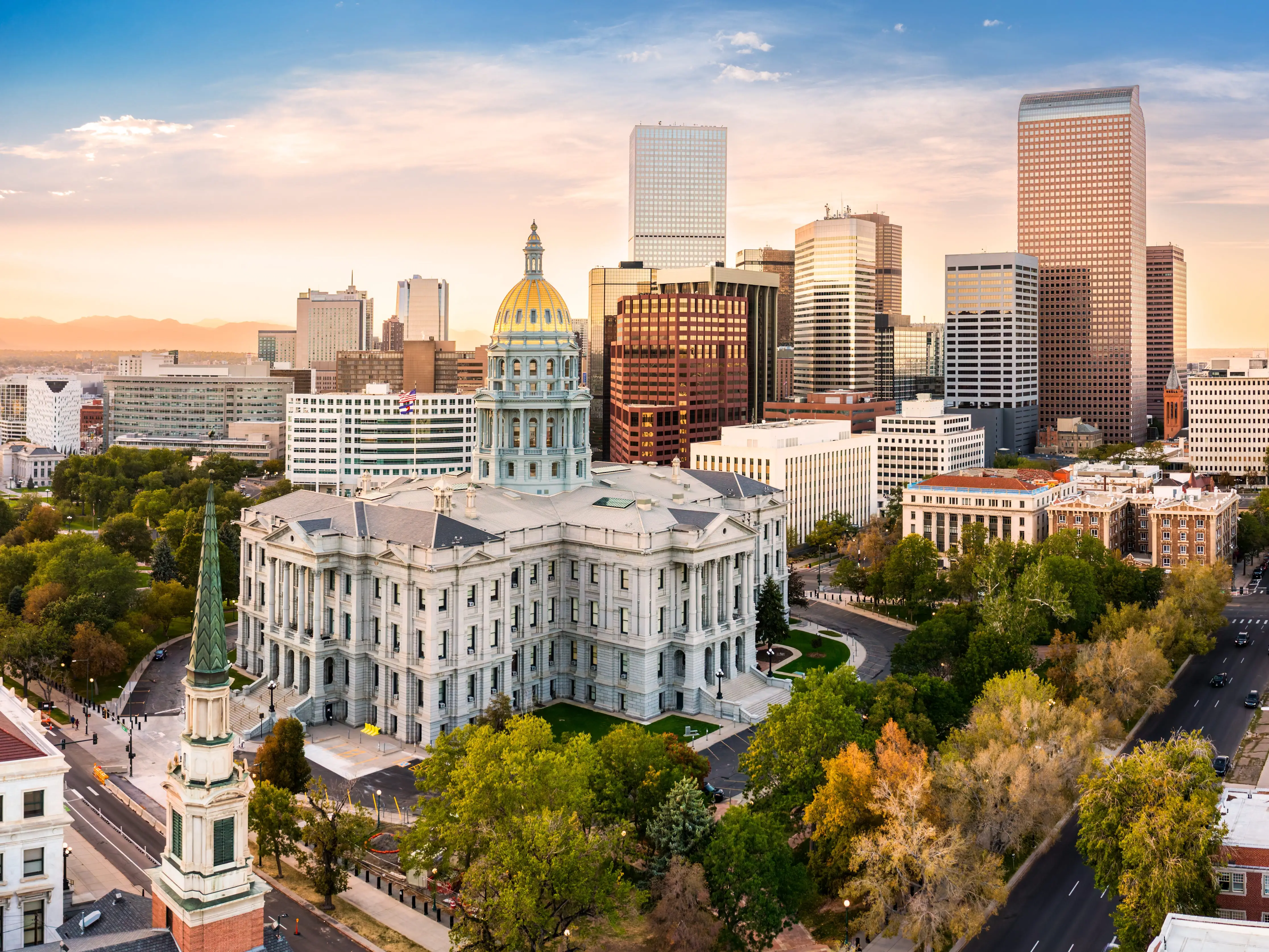 Aerial view of Colorado Capitol and Denver, Colorado skyline at sunset. Denver is a consolidated city and county, the capital, and most populous city of the U.S. state of Colorado
