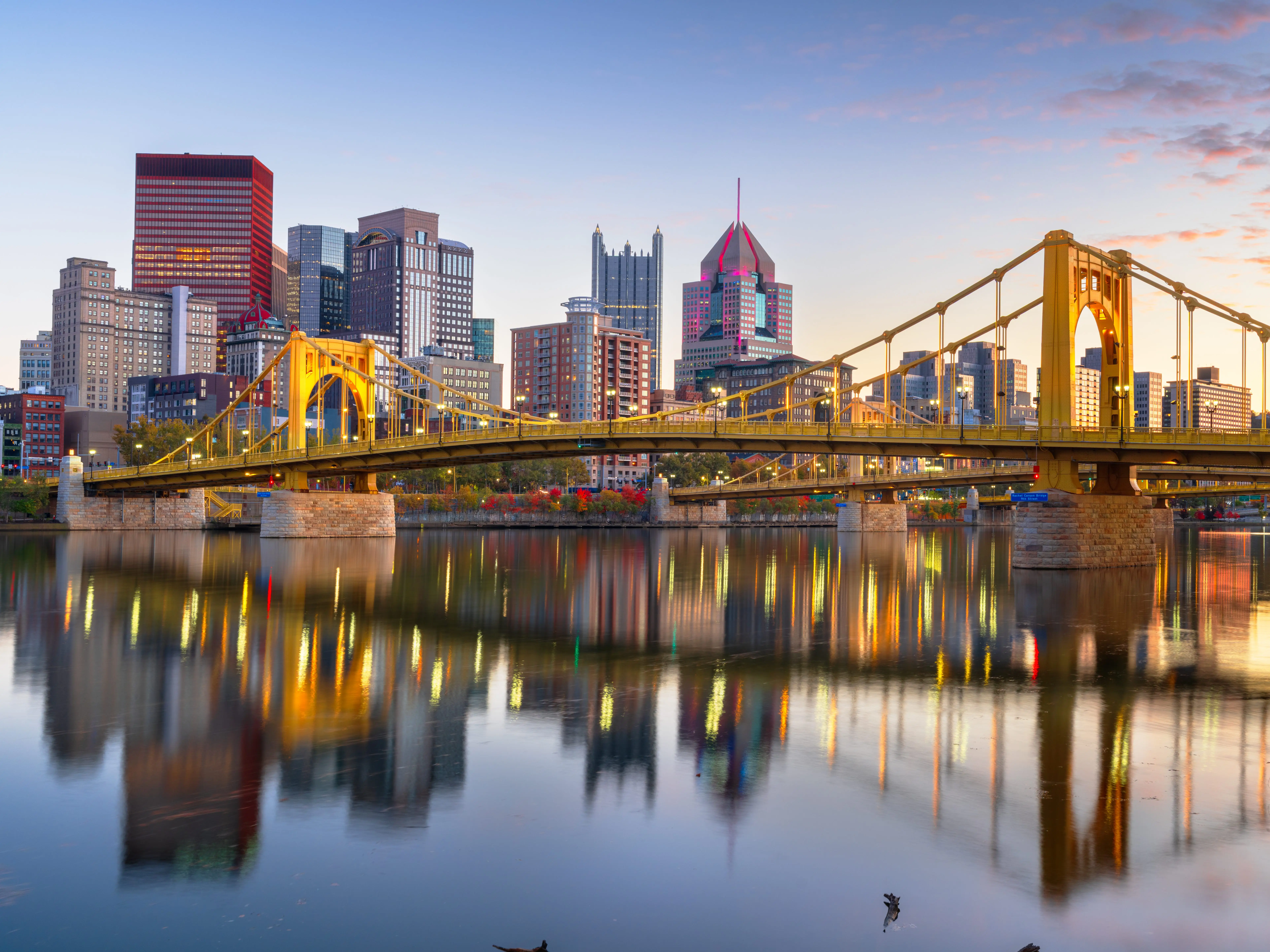 Pittsburgh, Pennsylvania, USA downtown city skyline on the Ohio River at dusk.