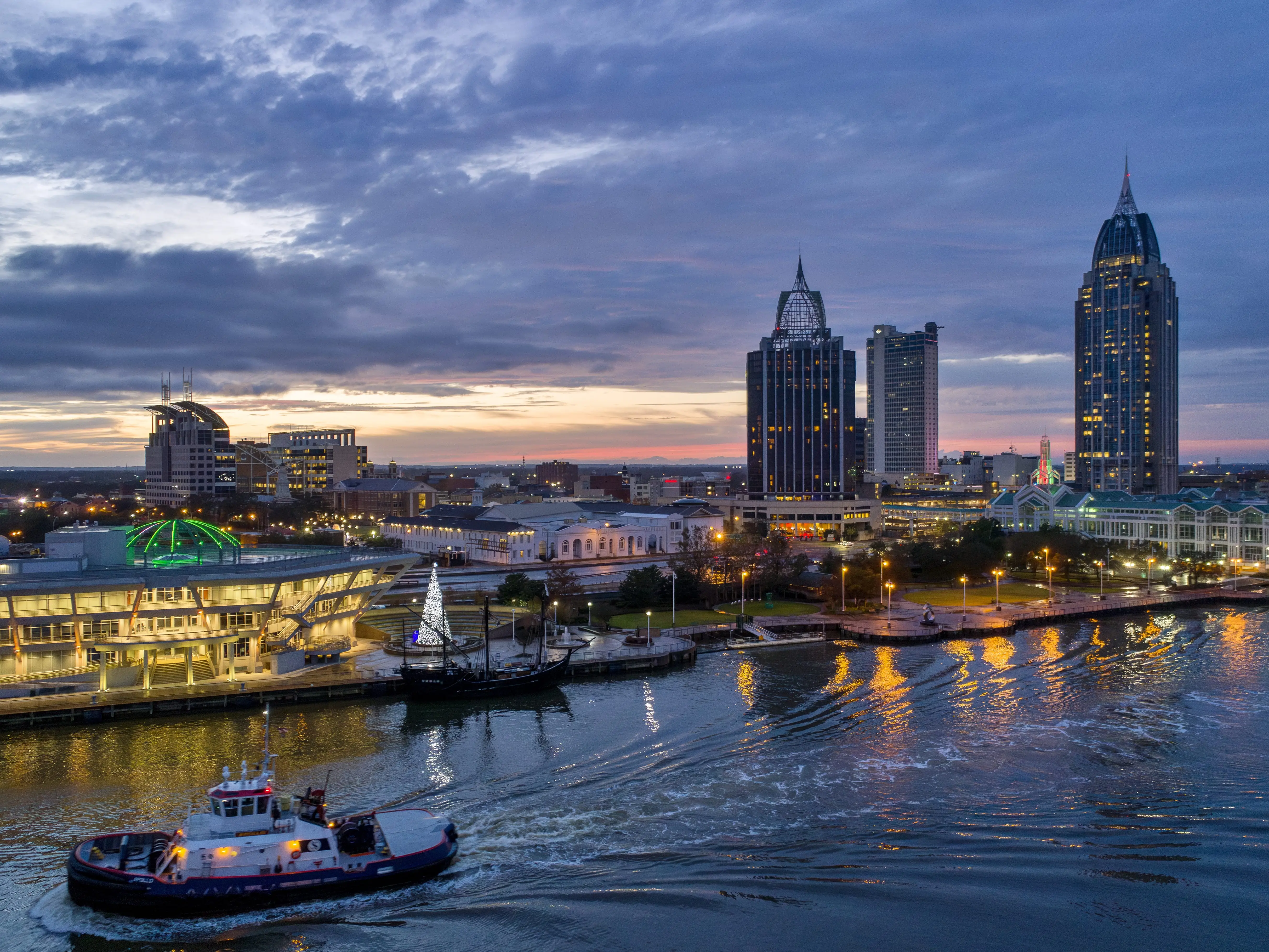 Drone shot of the Downtown Mobile, Alabama skyline at sunset